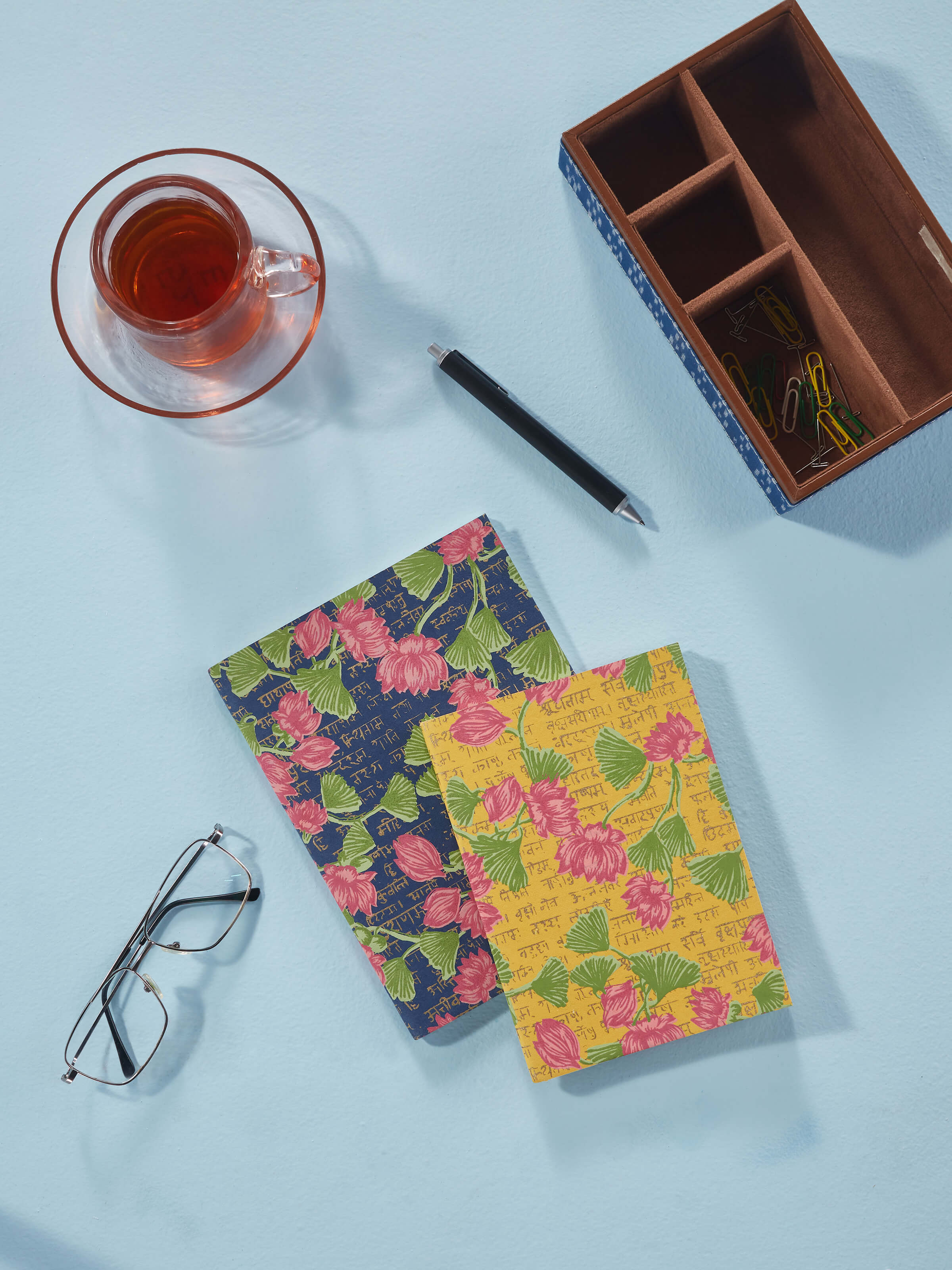 Side view of Handmade Paper Softbound Notebooks in yellow (2 pcs), showcasing the thickness and binding