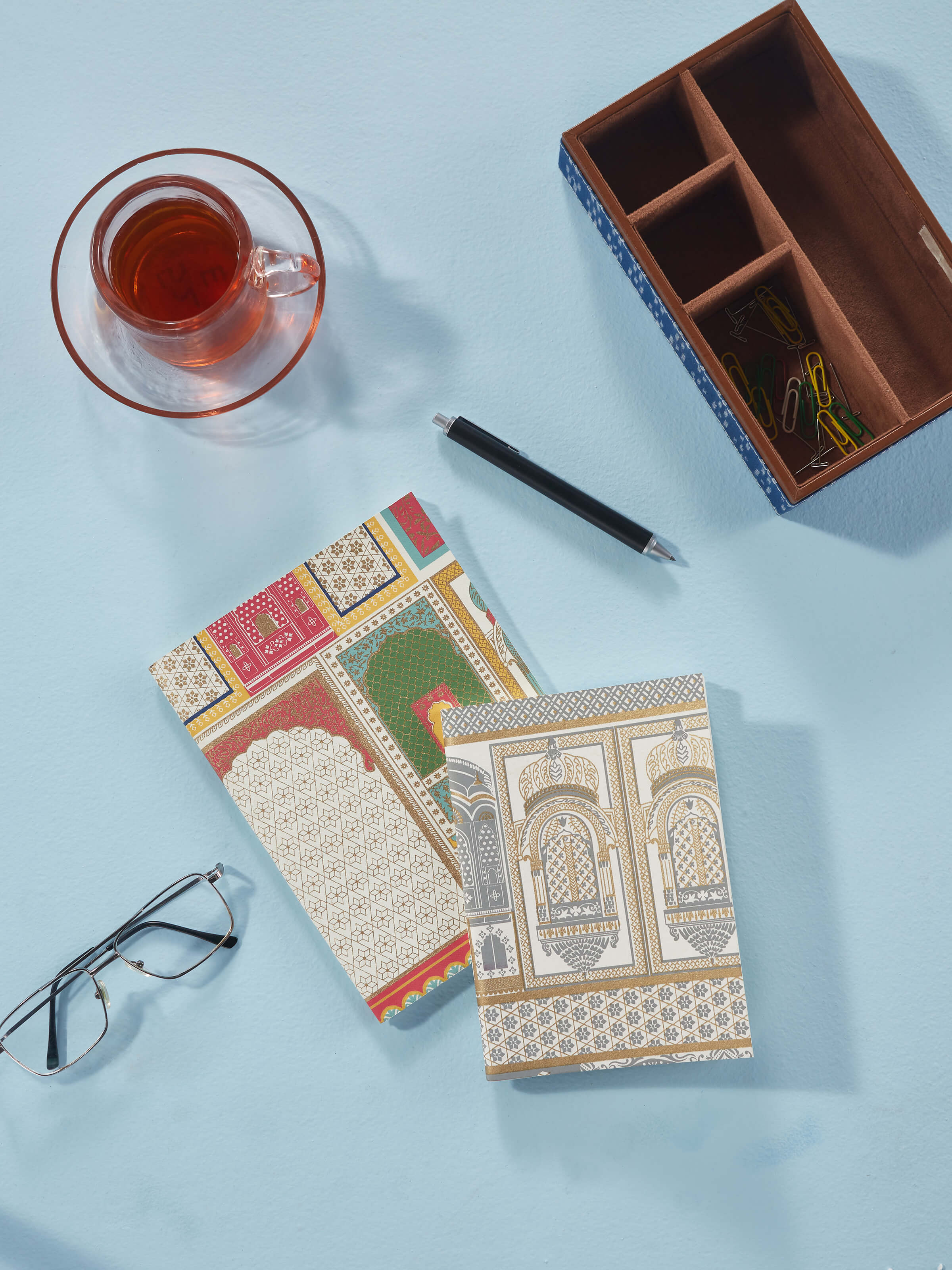 Side view of handmade paper soft bound notebooks in white, set of 2, showcasing the binding and cover