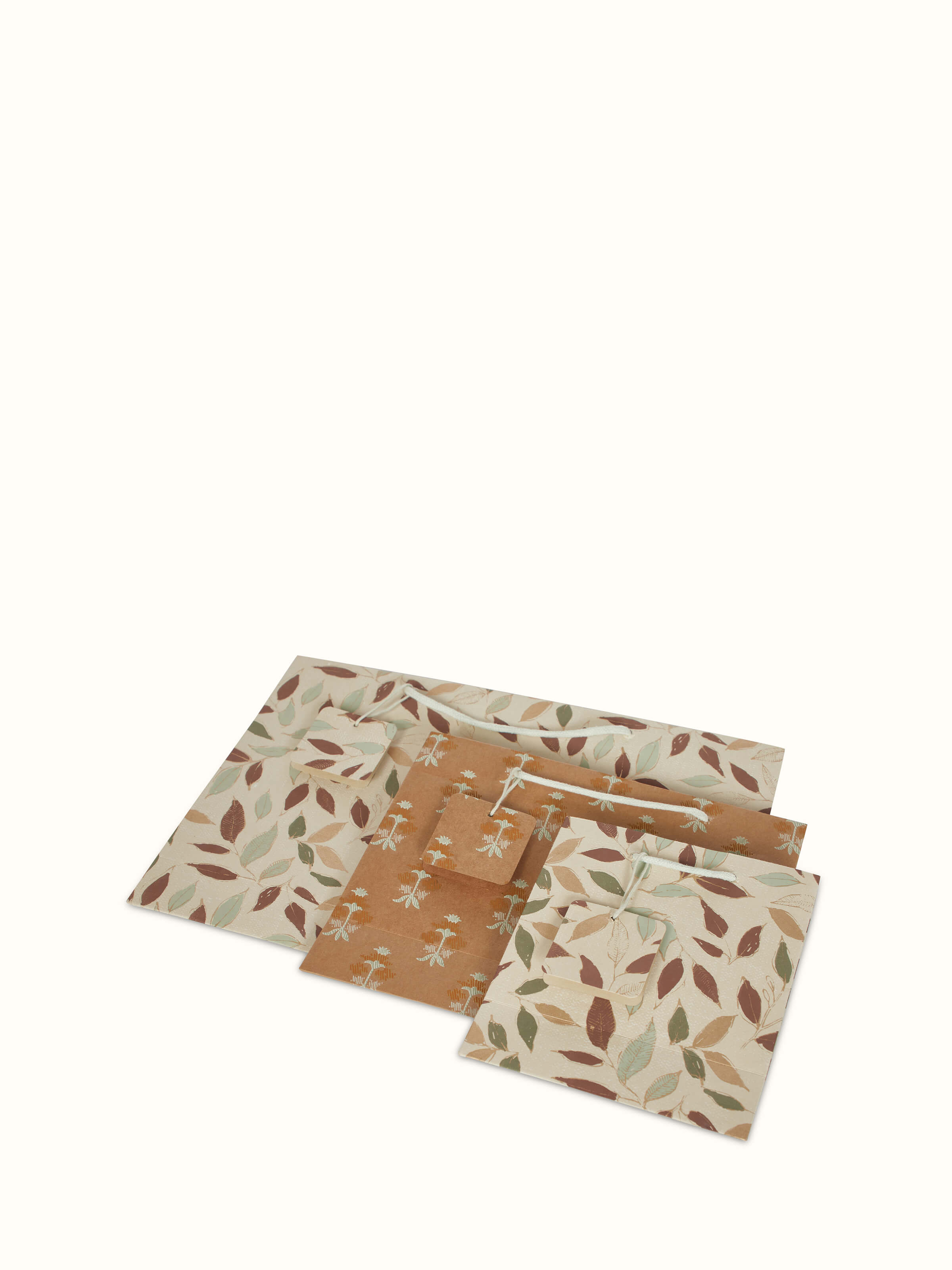 Close-up view of handmade paper gift bags in white (3 pcs), emphasizing the paper quality and details.