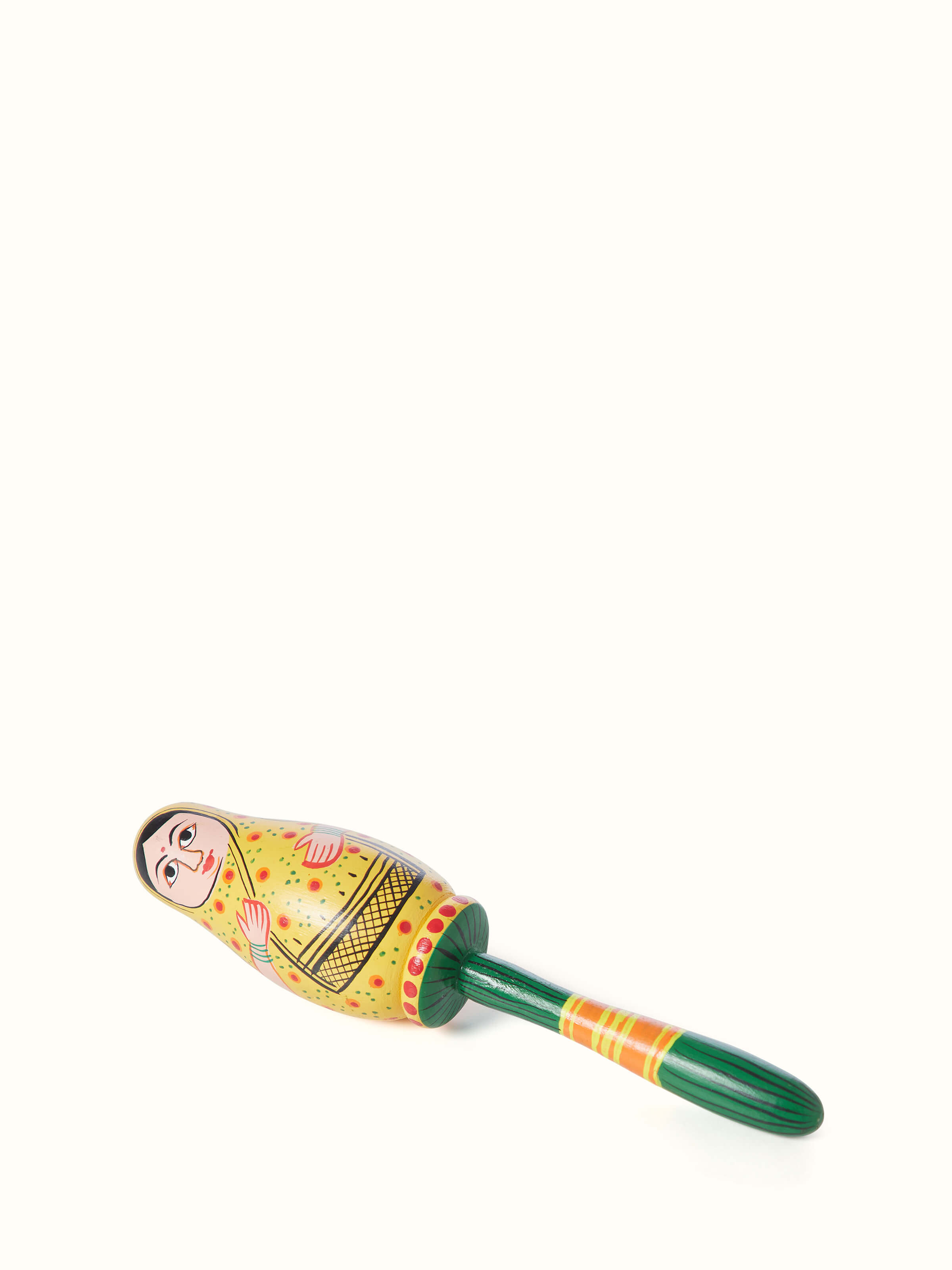 Front view of Wooden lady rattle toy in yellow showcasing its vibrant color and handcrafted design