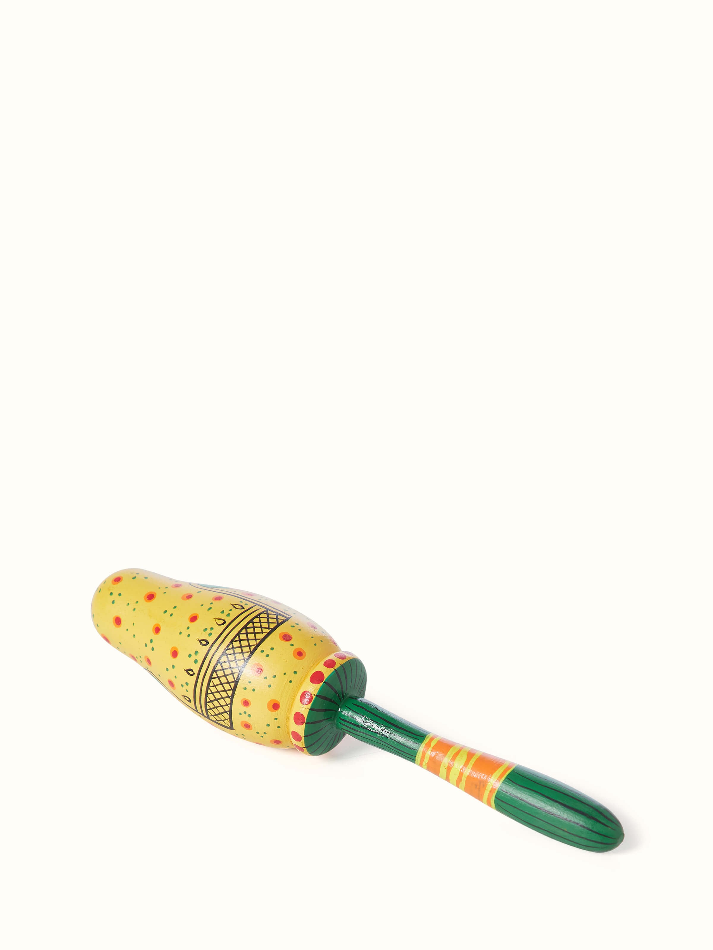 Angled view of Wooden lady rattle toy in yellow emphasizing its playful design and smooth texture