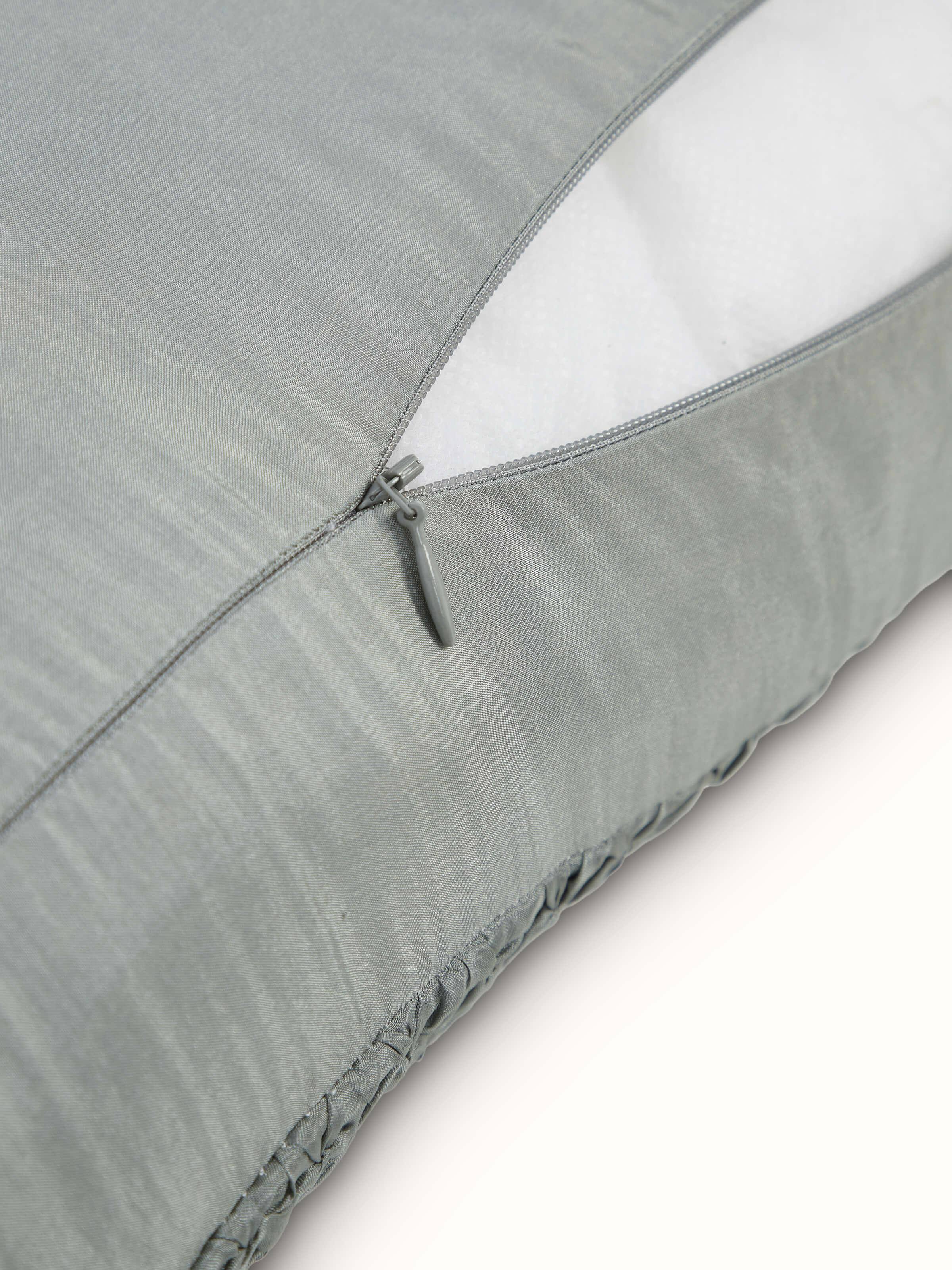 Svarupa Grey Textured Silk Bandhani Tie and Dye Cushion Cover in a decorative setting, emphasizing the color and texture.