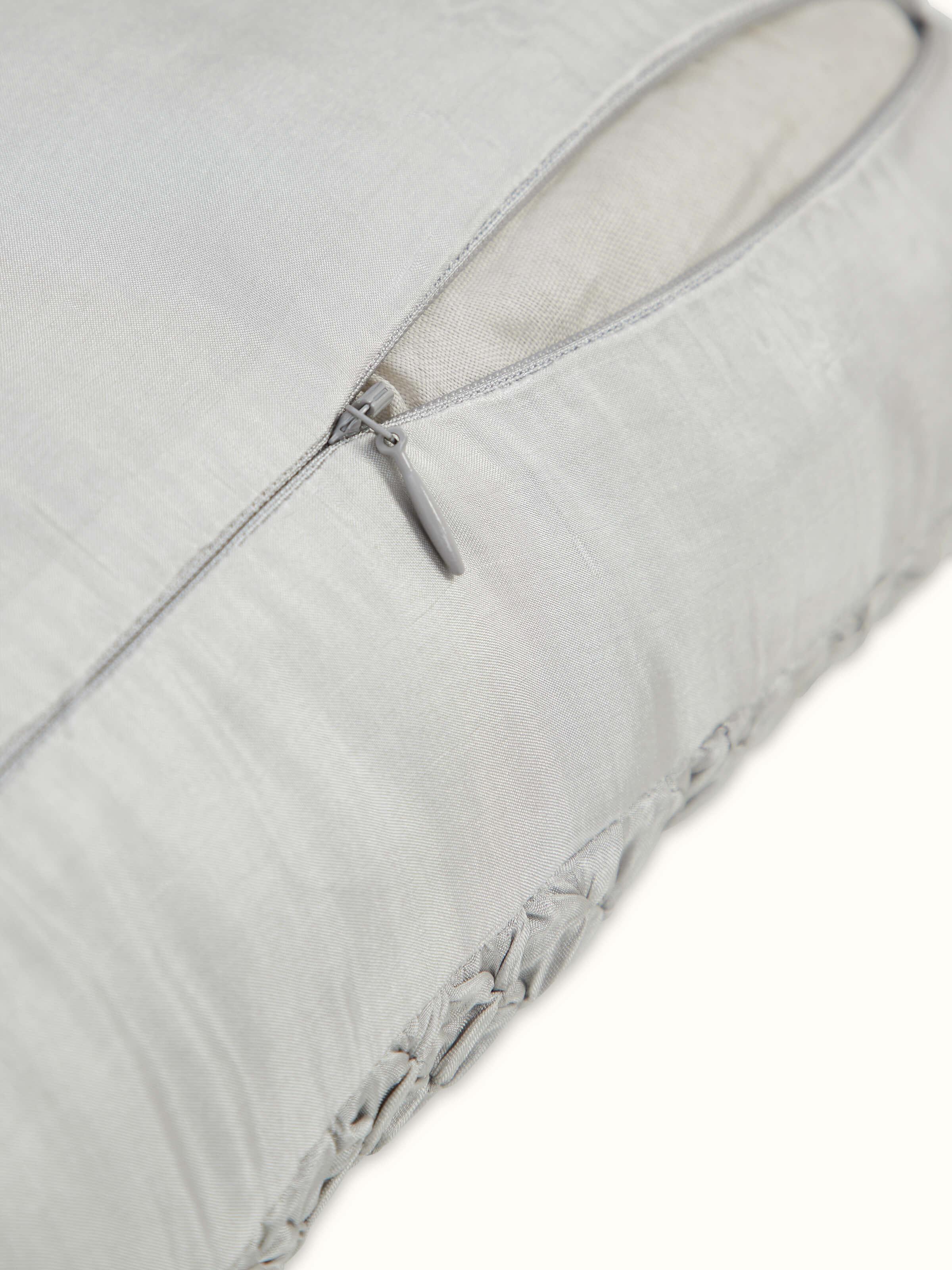 Detailed view of Svarupa light grey textured silk bandhani tie and dye cushion cover displaying the intricate tie and dye technique