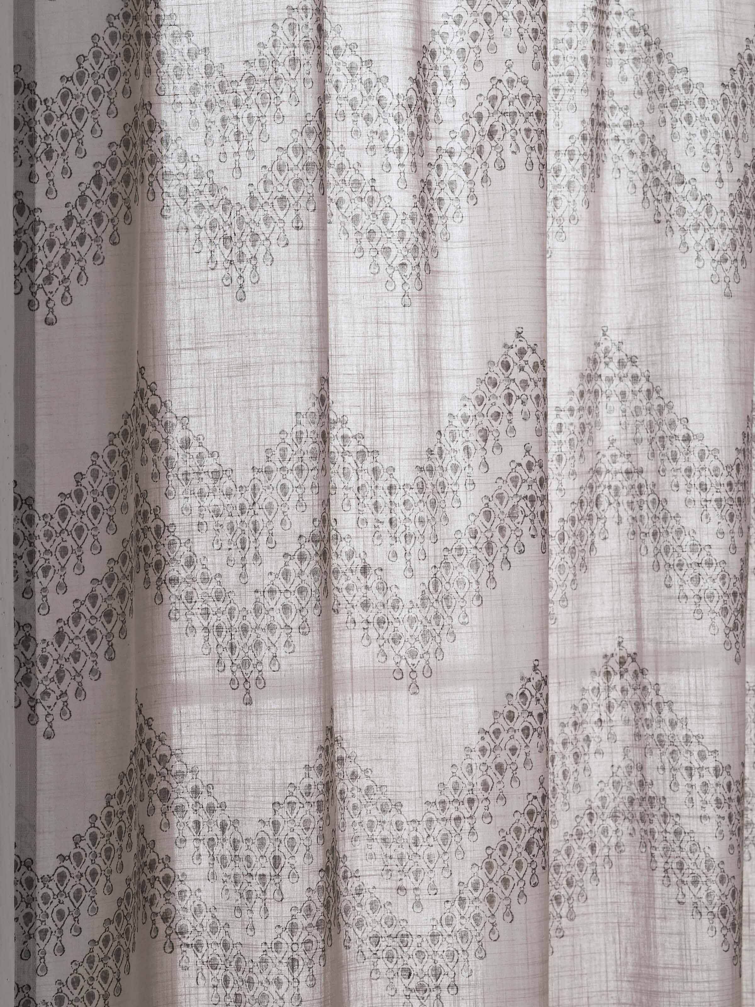 Folded view of Rambagh Light Grey Modern Geo Chevron Cotton Sanganeri Block Printed Curtain (9 ft), showcasing the fabric’s flexibility and pattern.