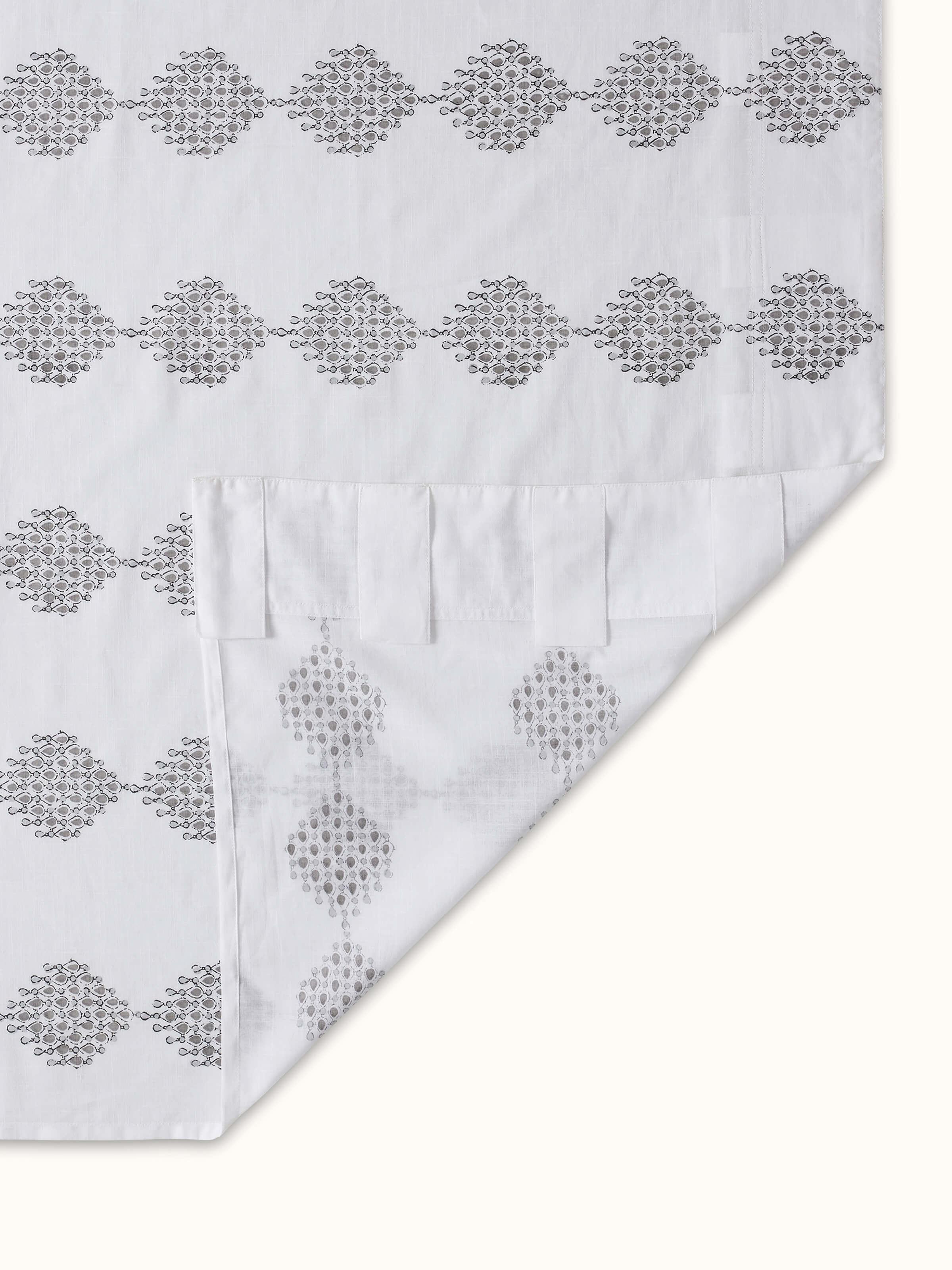 Front view of Rambagh white modern geo diamond cotton Sanganeri block printed curtain (7 ft) with detailed pattern