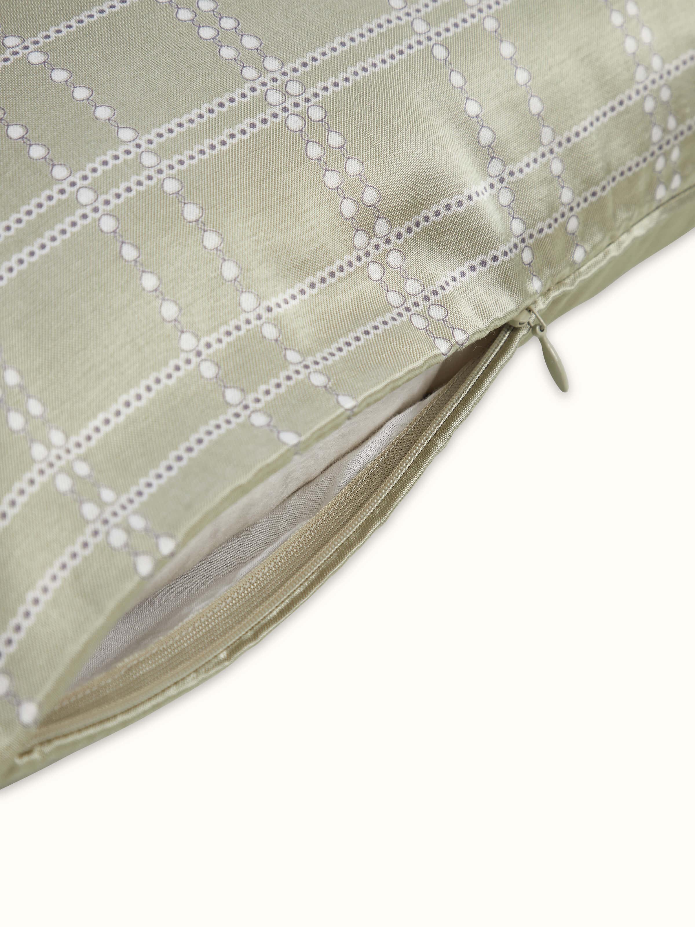 Detailed view of Rambagh green checkered cotton blend Sanganeri block printed cushion cover focusing on the fabric and print