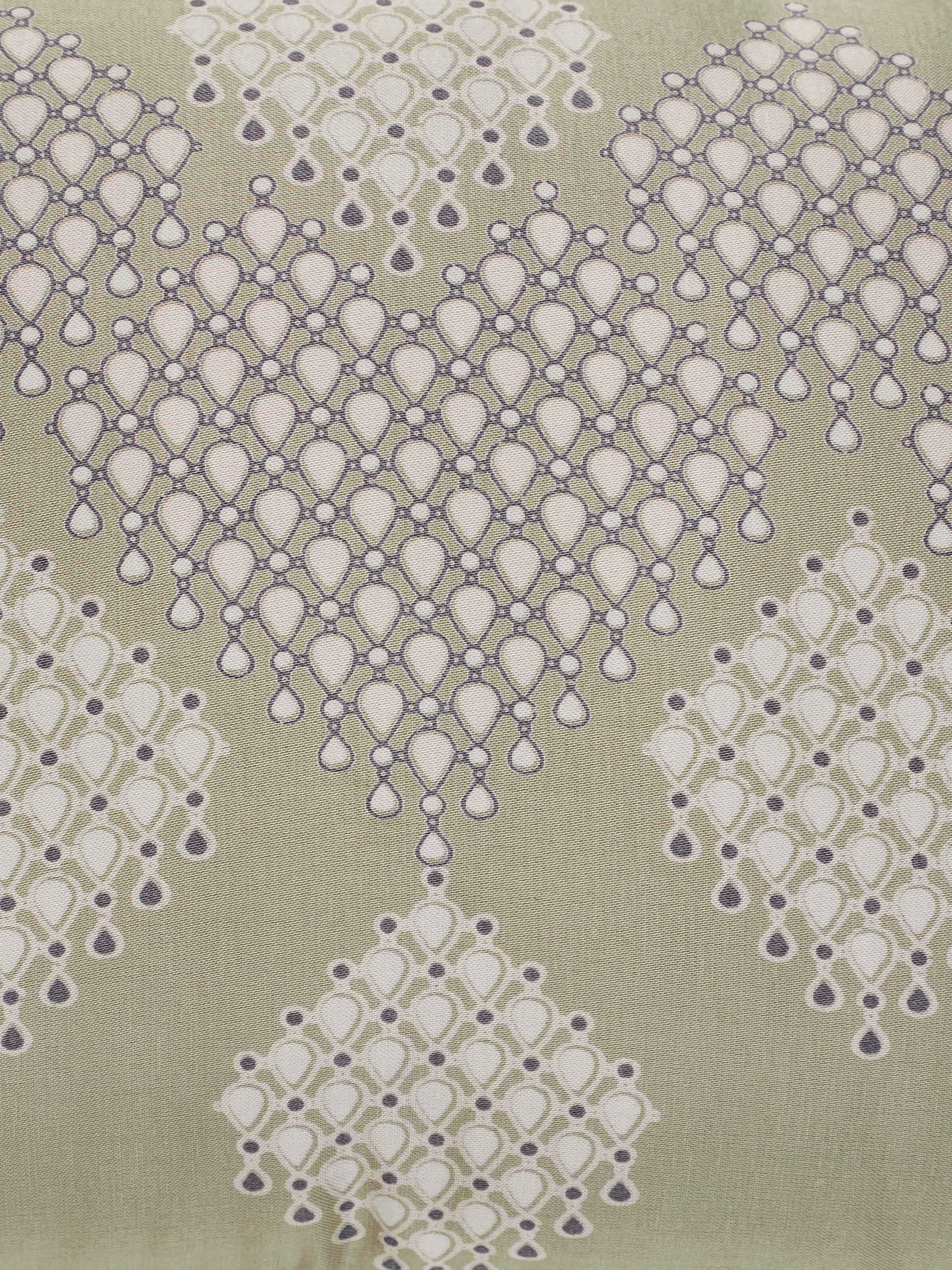 Folded view of Rambagh green modern geo viscose cotton Sanganeri block printed cushion cover displaying the design and fabric details.