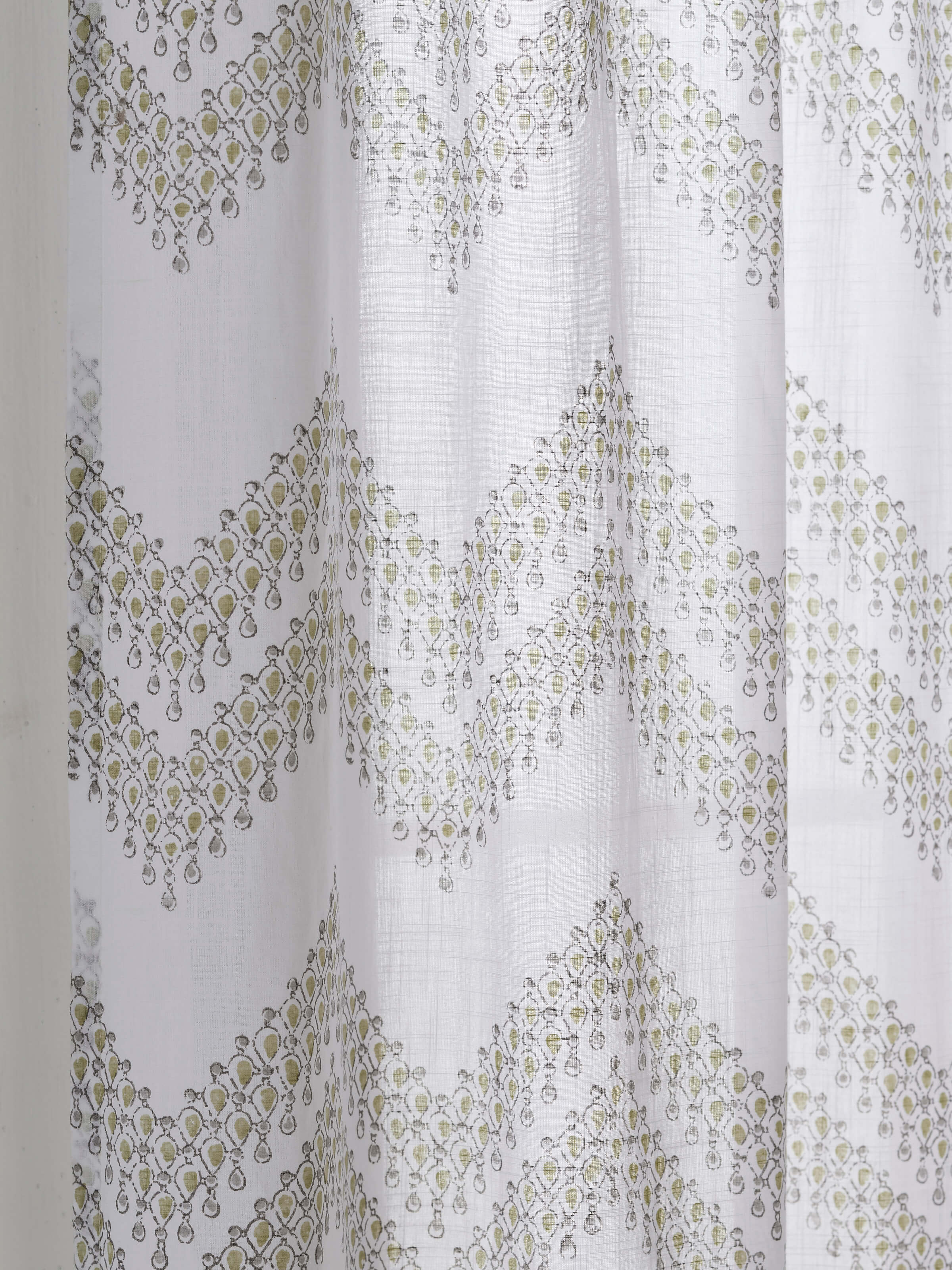 Full-length shot of Rambagh white modern geo cotton Sanganeri block printed curtain, displaying its length and pattern