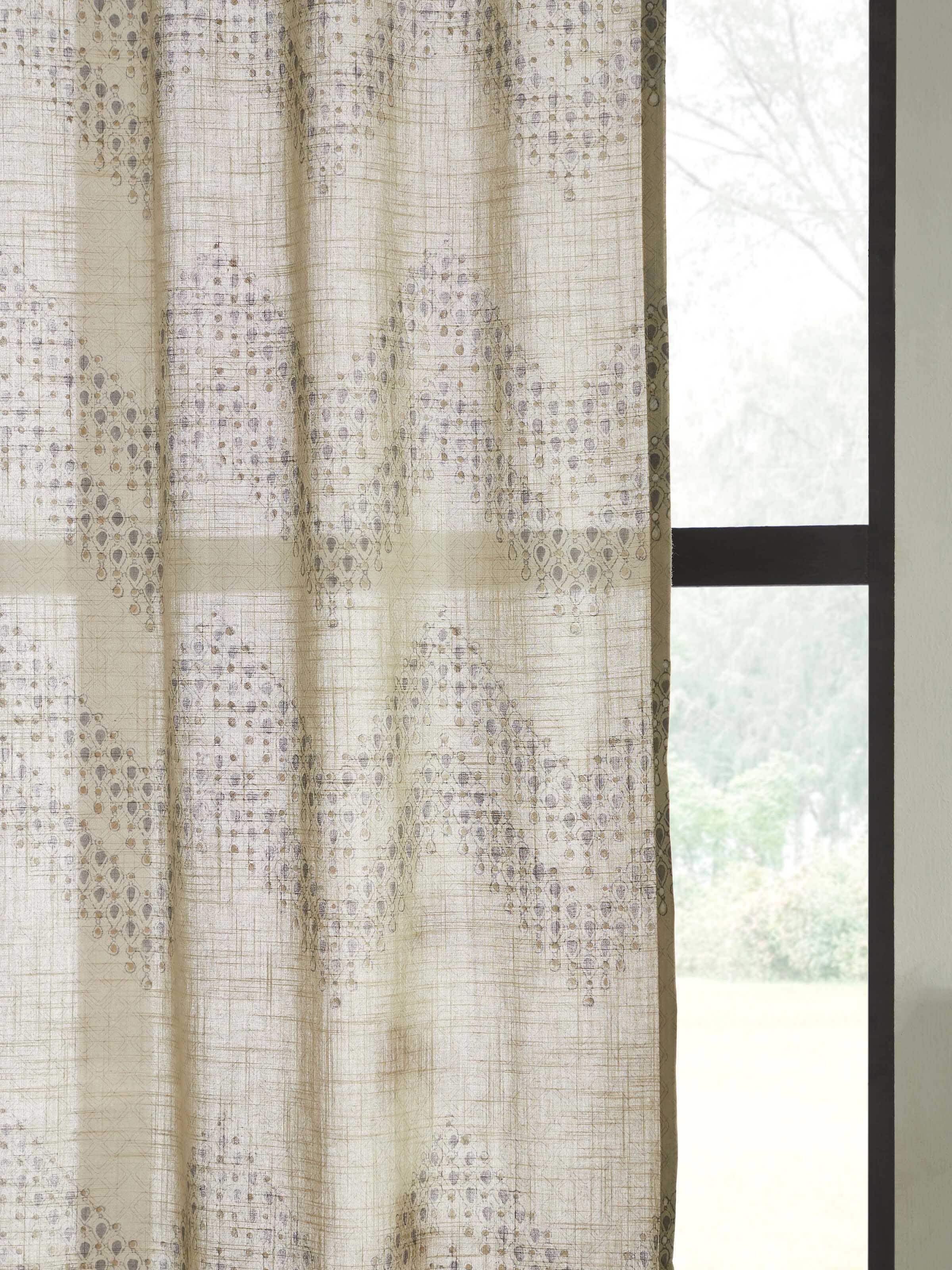 Angled view of Rambagh Light Green Modern Geo Chevron Cotton Sanganeri Block Printed Curtain (9 ft), displaying its design and drape.