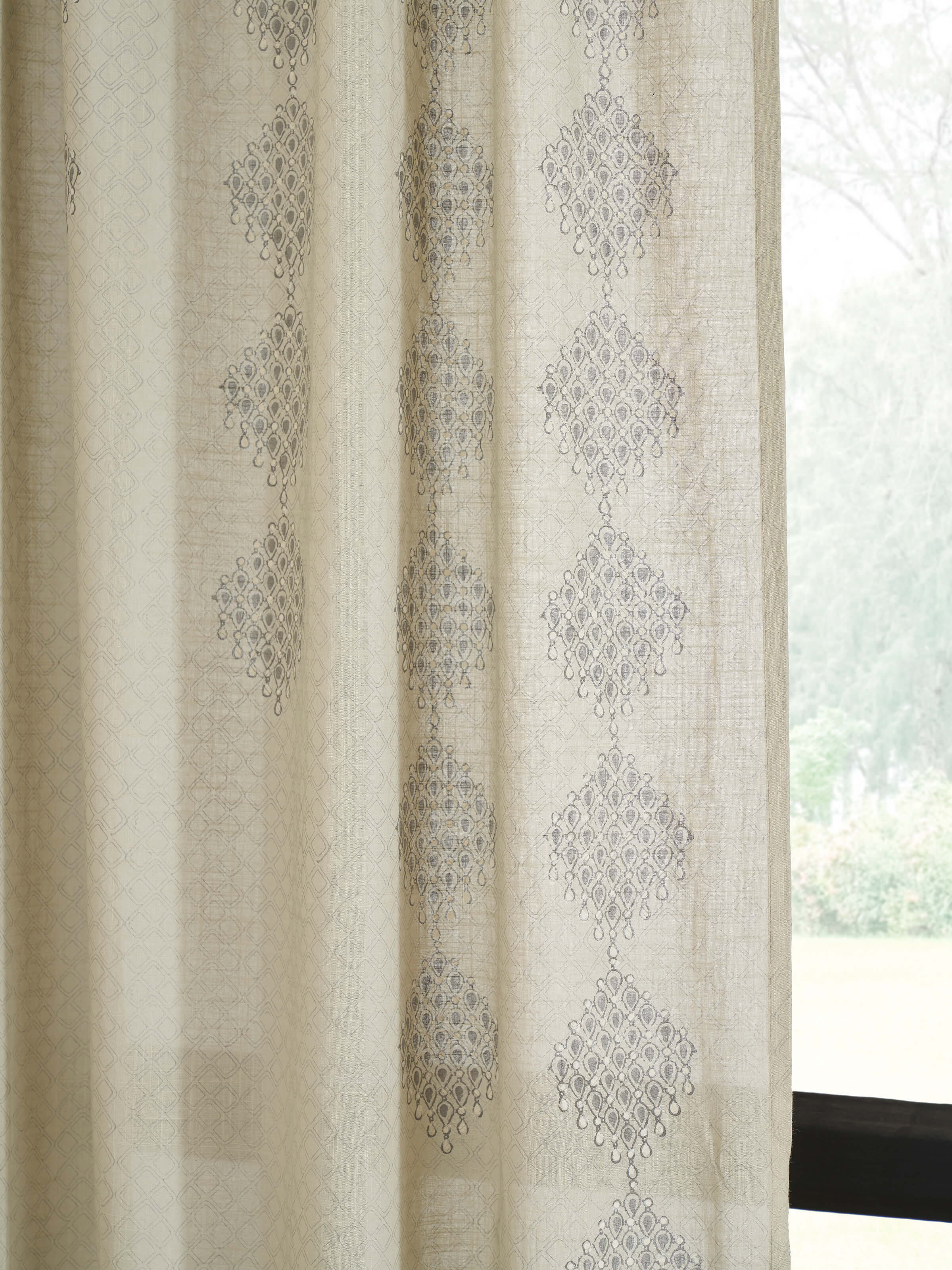 Full view of Rambagh light green modern geo diamond cotton Sanganeri block printed curtain (7 ft) showing the curtain hanging in a setting