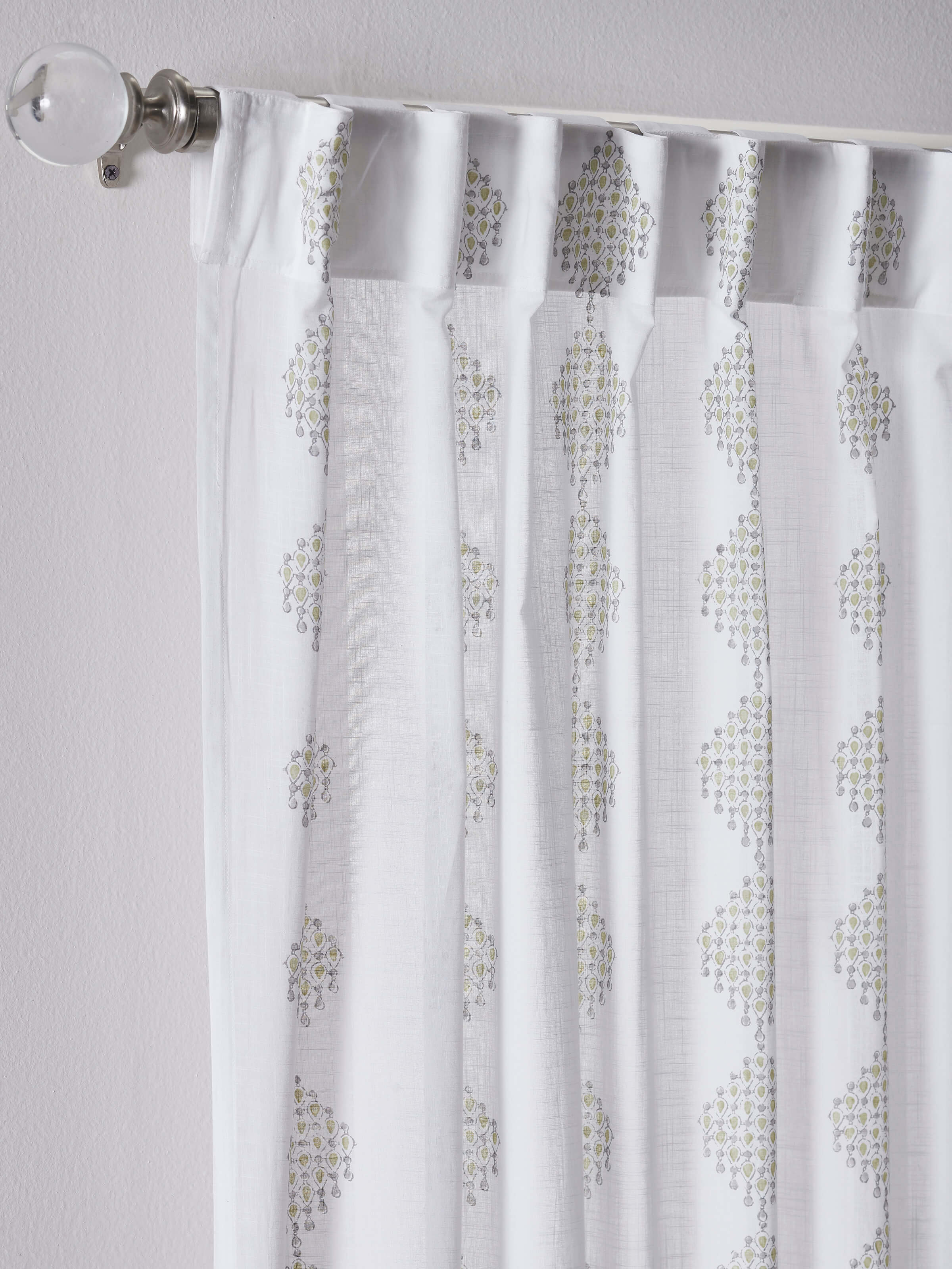 Rambagh white and green modern geo cotton curtain, showing the full length and pattern