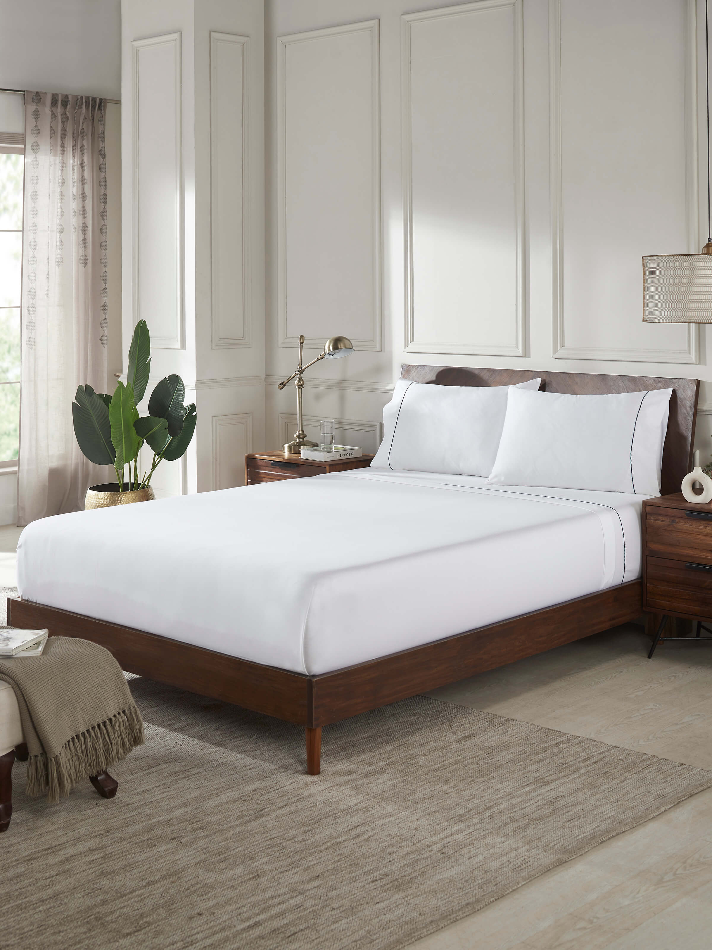 Close-up view of Shivranjini blue stripe cotton hand embroidered bedsheet king set (3 pcs), focusing on the hand embroidery.