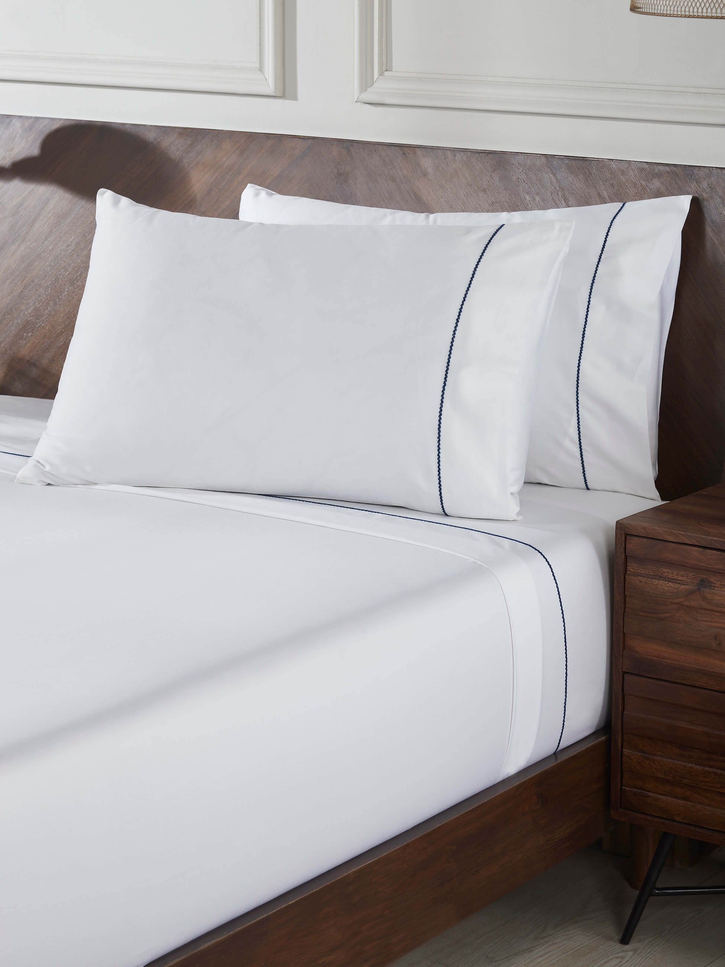 Detailed view of Shivranjini blue stripe cotton hand embroidered bedsheet king set (3 pcs), showcasing the blue stripe pattern.