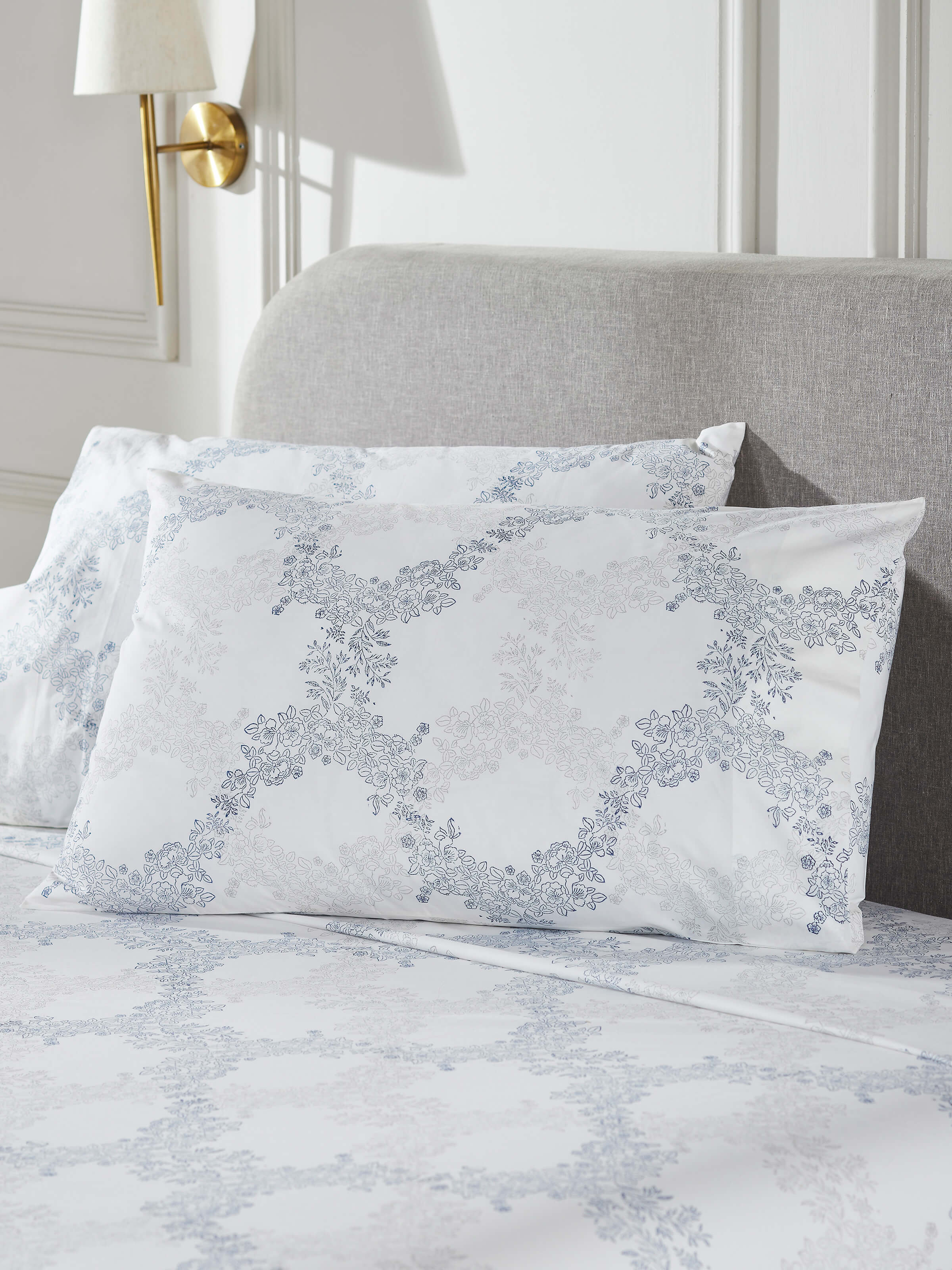 Close-up of Shivranjini grey trellis cotton Sanganeri block printed queen bedsheet set, highlighting the intricate block print design and fabric texture