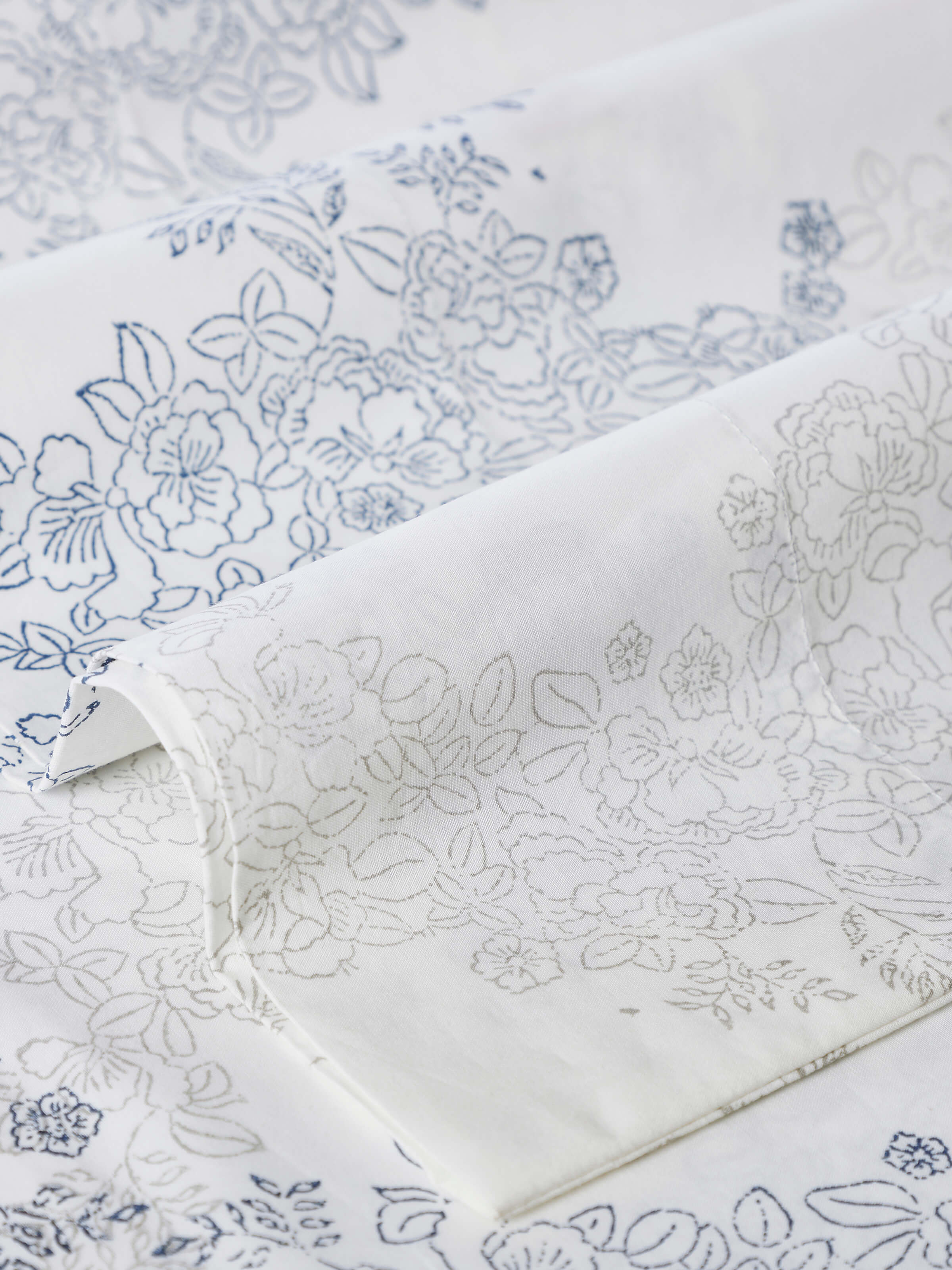 Image of Shivranjini grey trellis cotton Sanganeri block printed queen bedsheet set, displaying the complete set on a bed, including the bedsheet and pillow covers