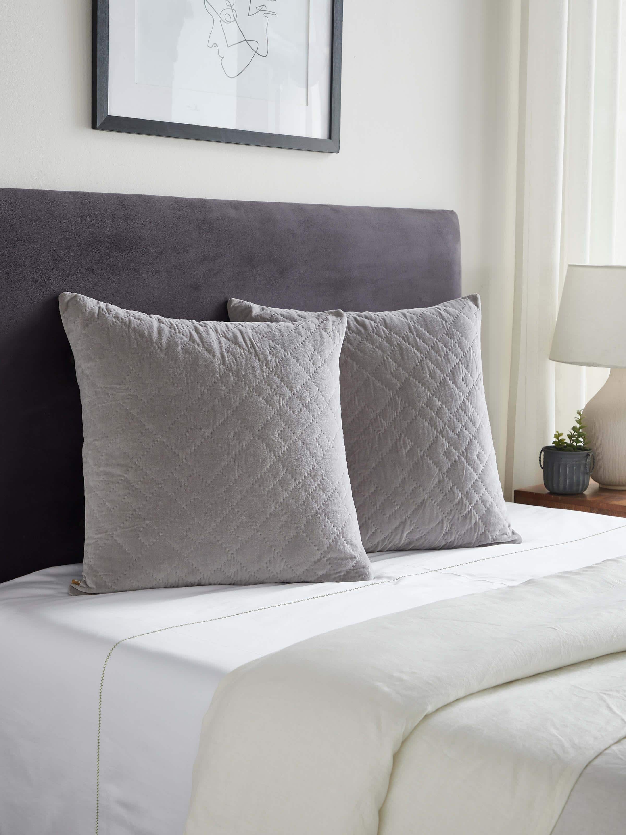 Side view of Shivranjini light grey solid textured cotton razai embroidered euro shams, highlighting the design