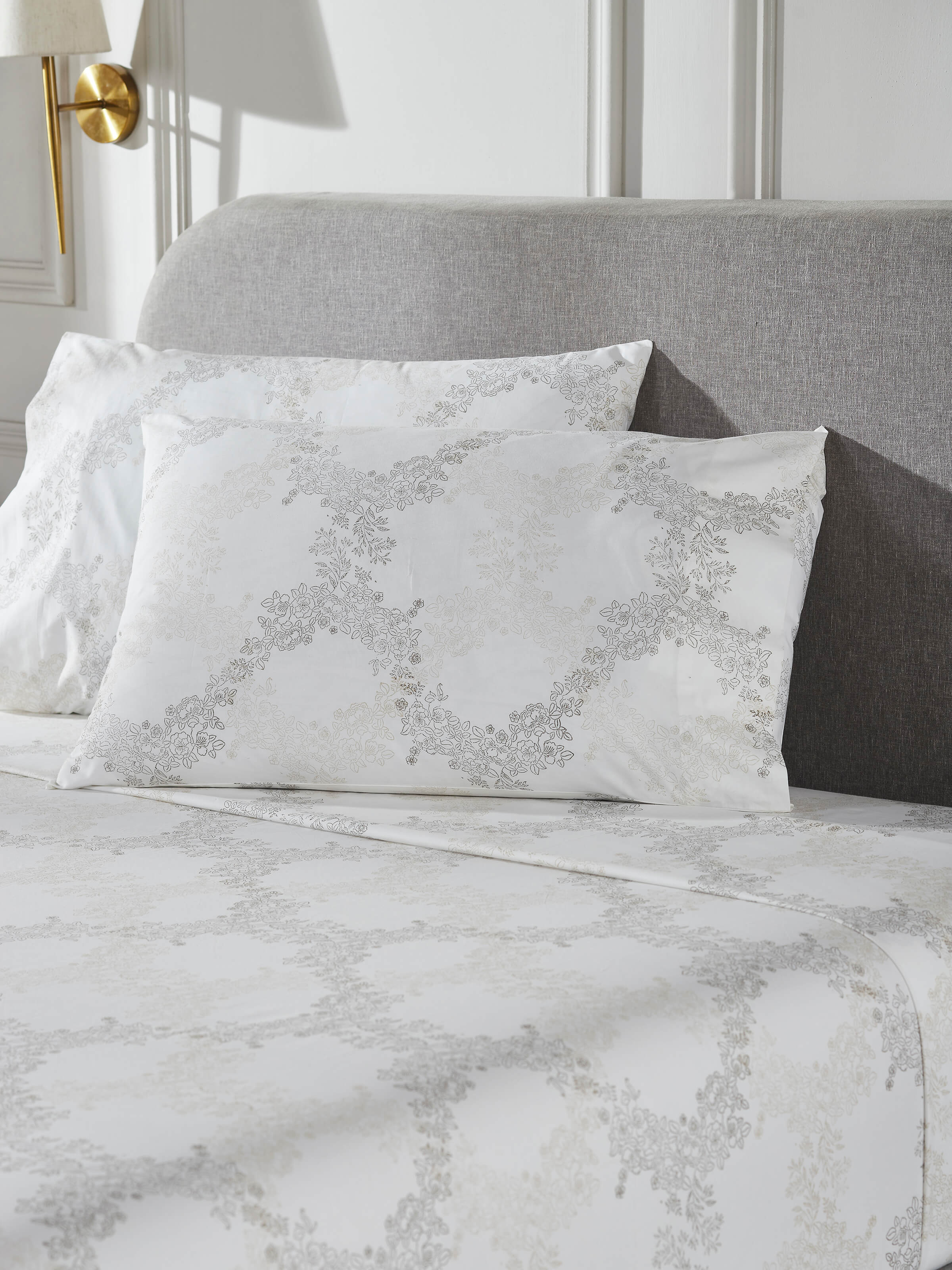 Detailed view of Shivranjini beige trellis cotton Sanganeri block printed king bedsheet set, including pillowcases