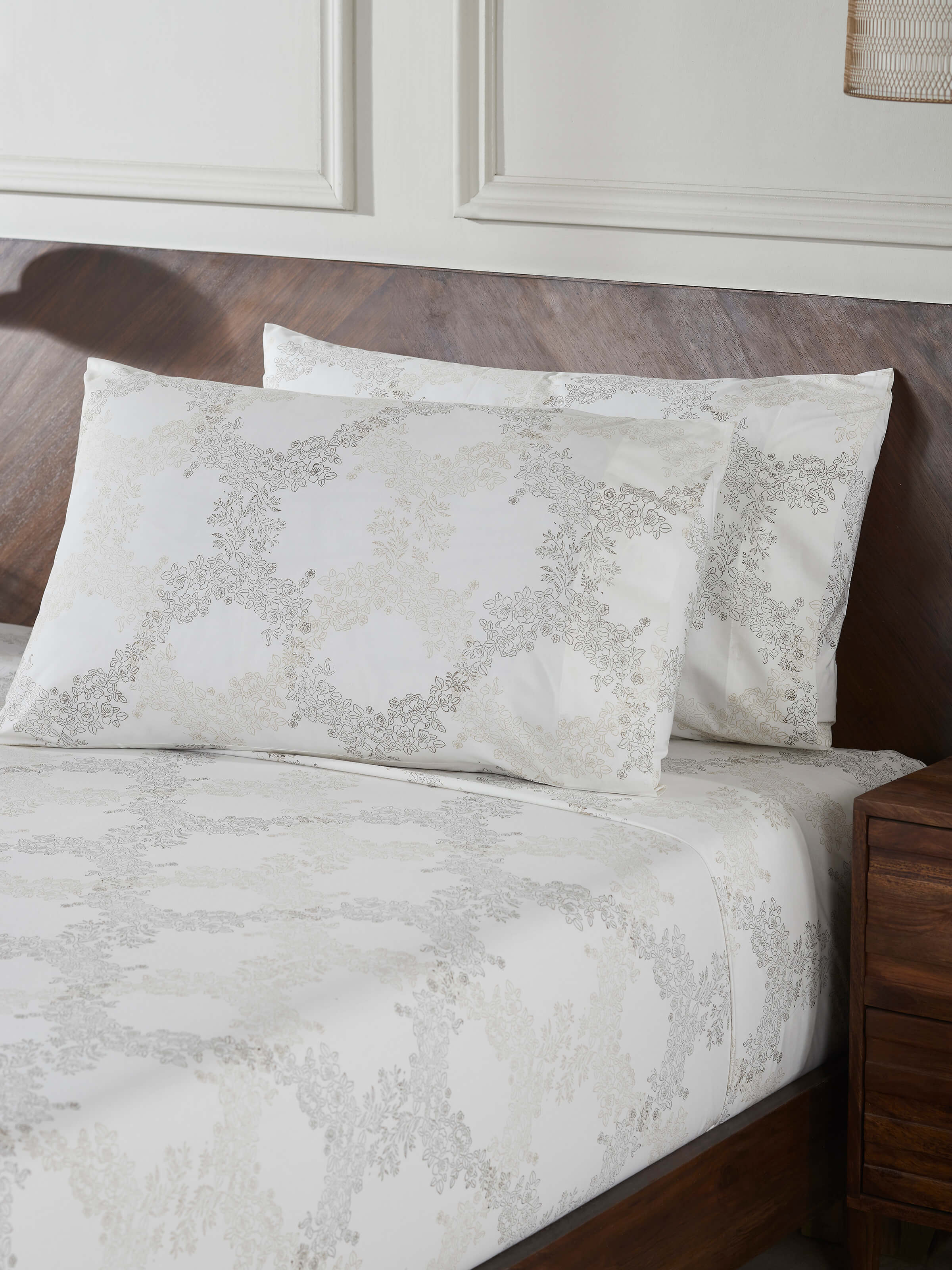 Detailed view of Shivranjini beige trellis cotton Sanganeri block printed queen bedsheet set (3 pcs) highlighting the block print and fabric quality.