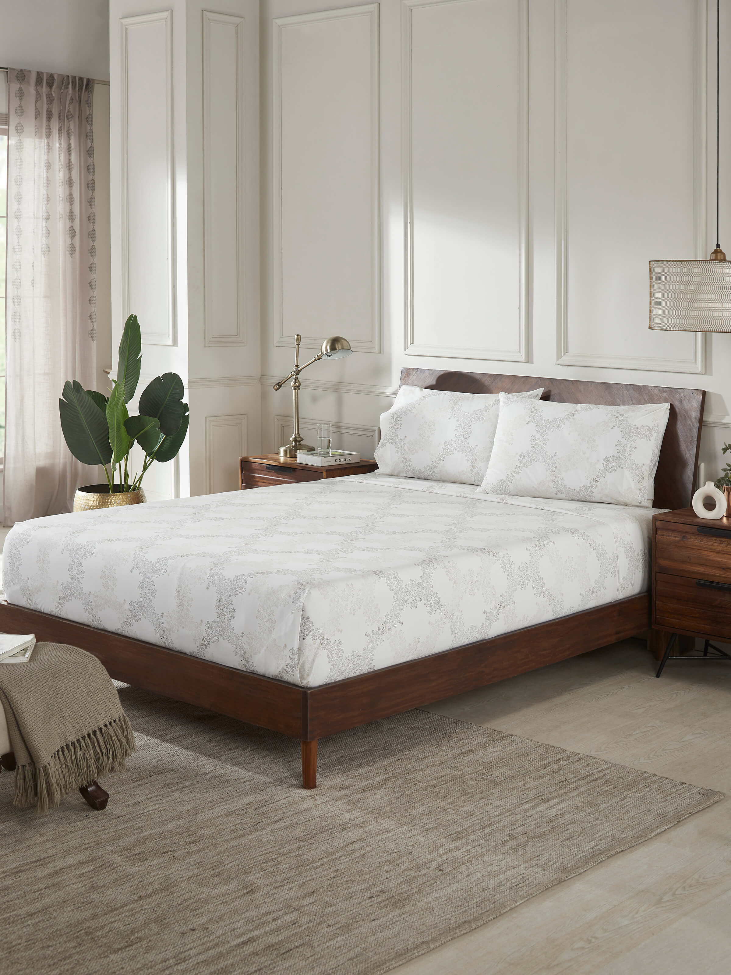 Perspective view of Shivranjini beige trellis cotton Sanganeri block printed queen bedsheet set (3 pcs) displaying the overall design and block print.