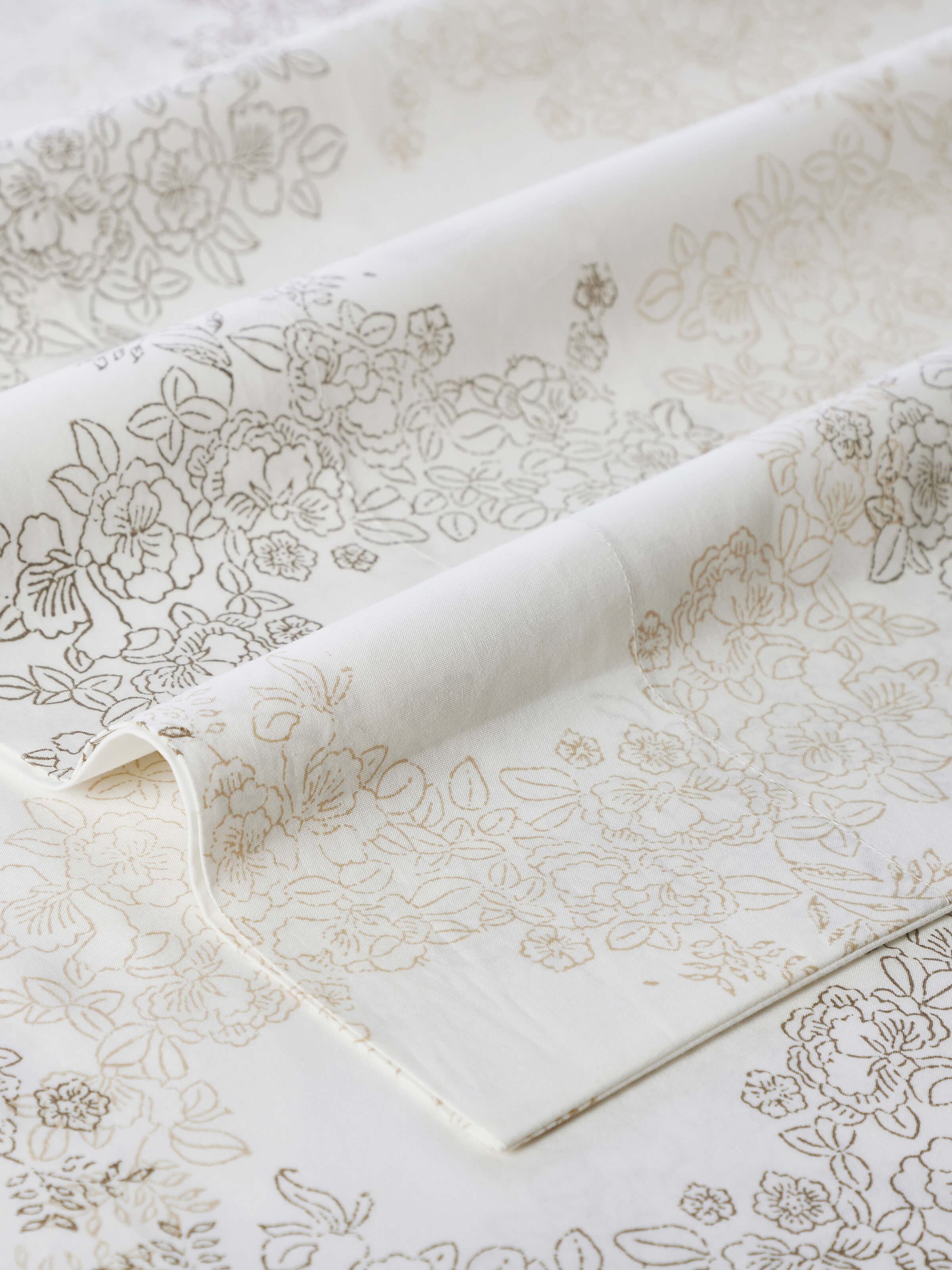 Close-up of Shivranjini beige trellis cotton Sanganeri block printed queen bedsheet set (3 pcs) focusing on the trellis pattern and block print details.