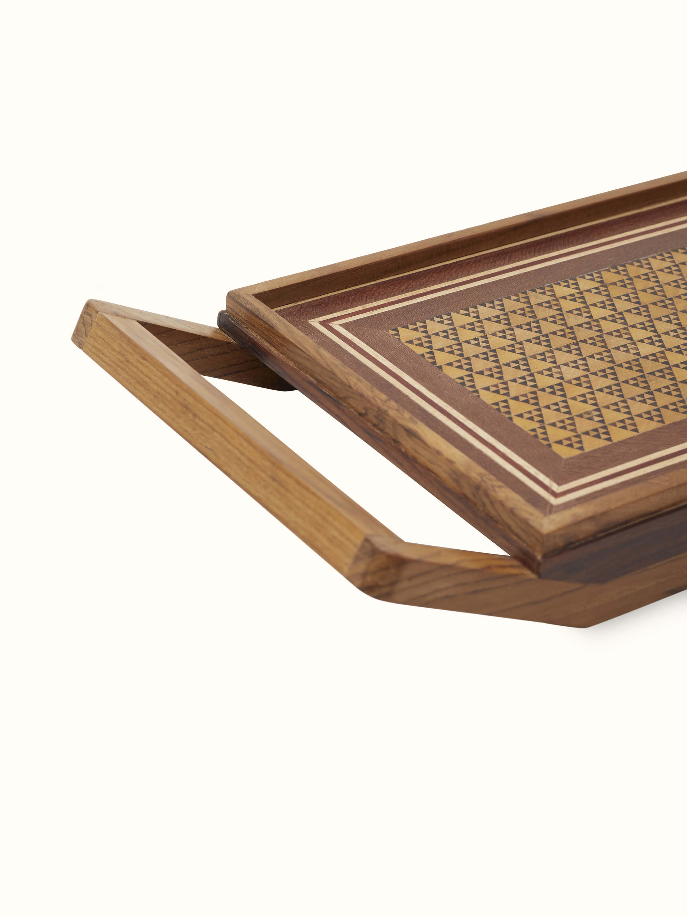 Angled view of Marquetry wood & MDF serving tray (14 x 6 inches) displaying decorative elements