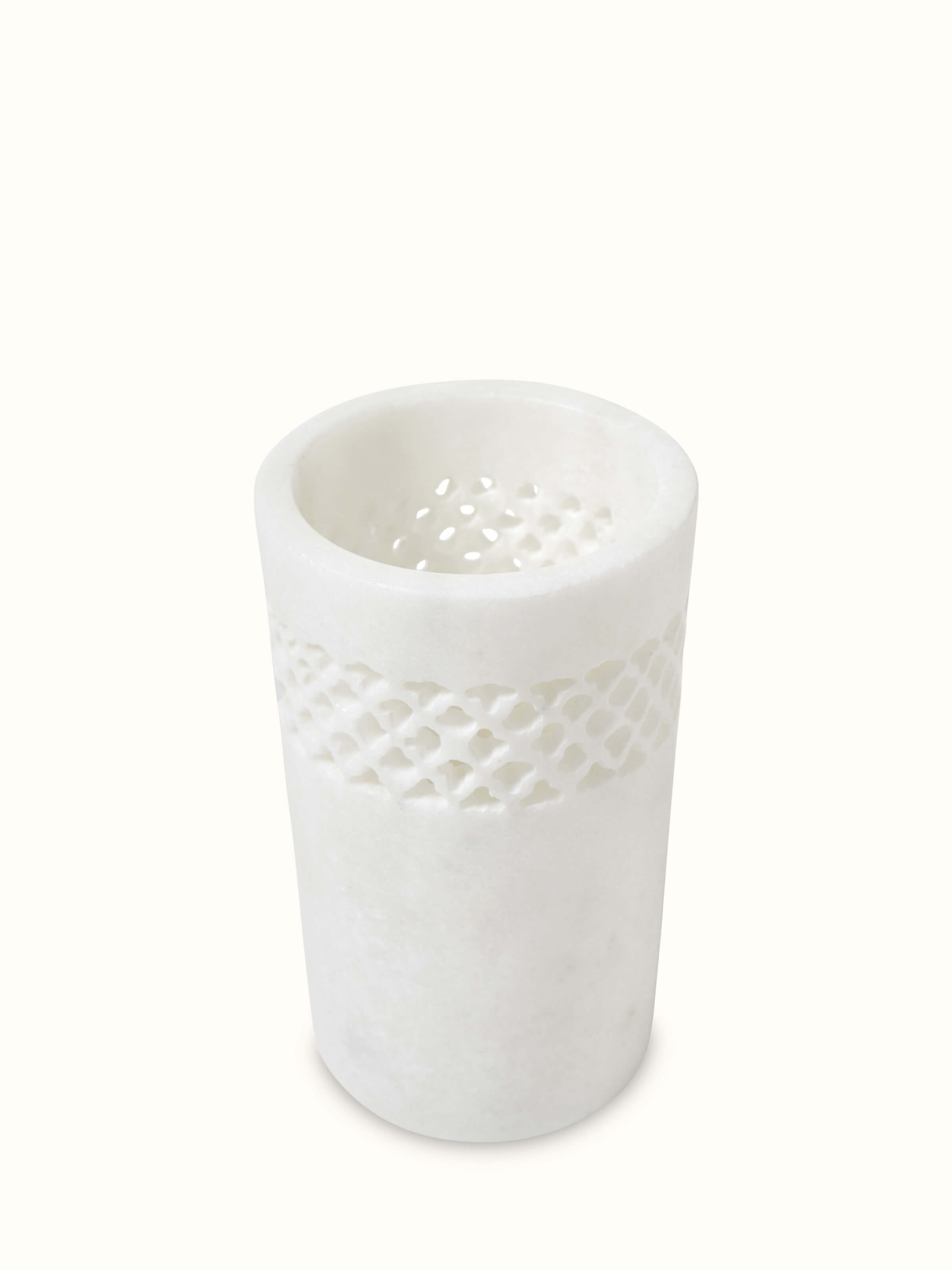Angled view of Carved Ambaji white marble toothbrush holder showcasing the elegant form and intricate carvings
