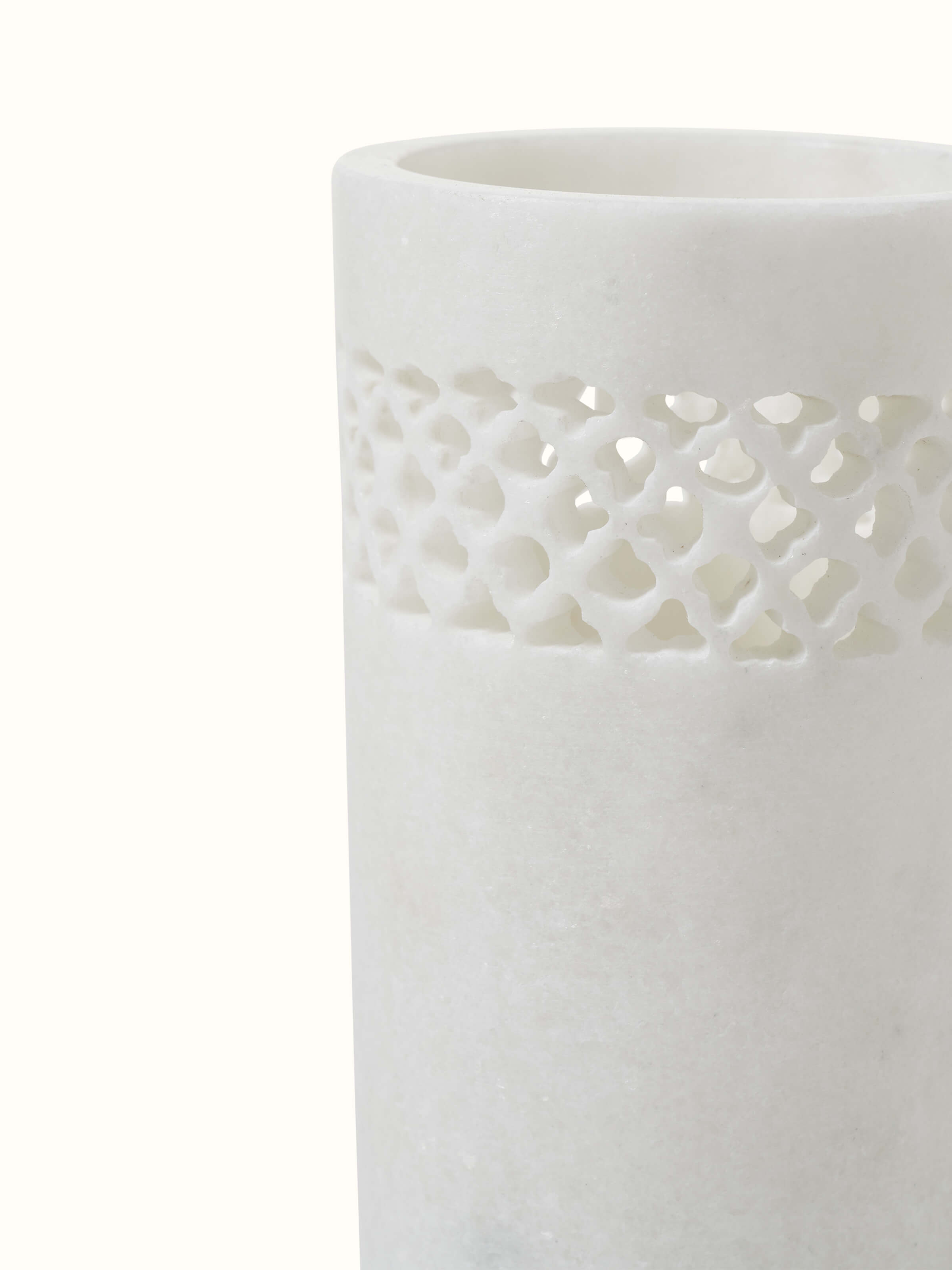 Close-up view of Carved Ambaji white marble toothbrush holder emphasizing the detailed carving and marble quality