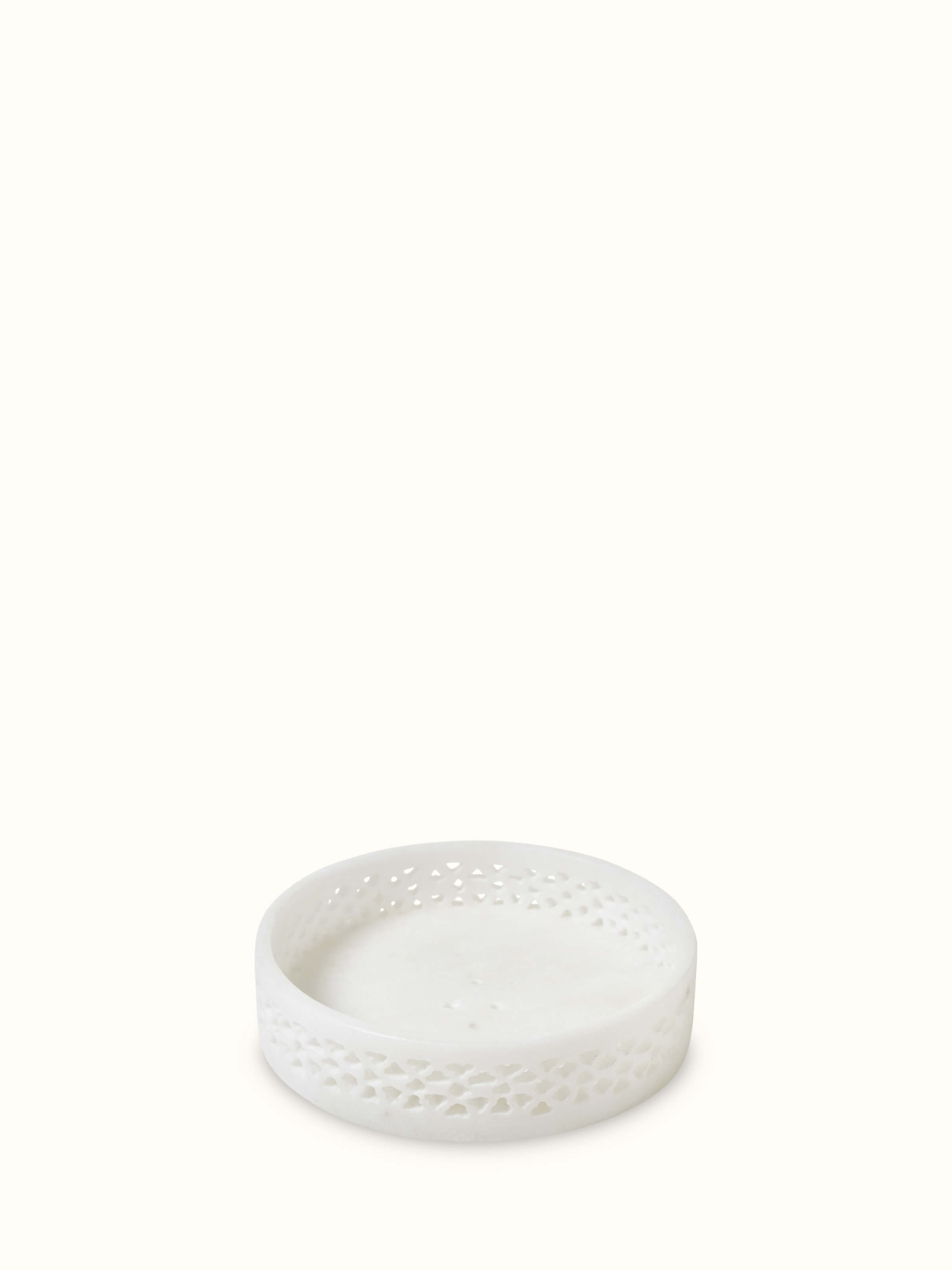 Side view of carved Ambaji white marble soap dish, highlighting its elegant design and craftsmanship.