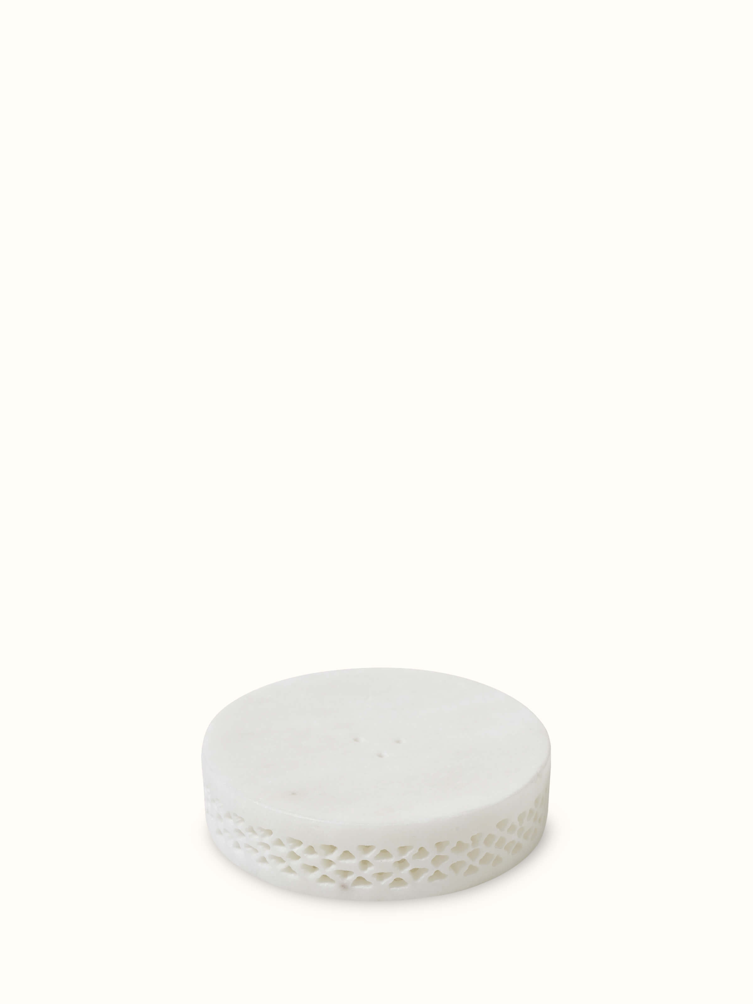 Top view of carved Ambaji white marble soap dish, revealing its elegant shape and fine marble quality.