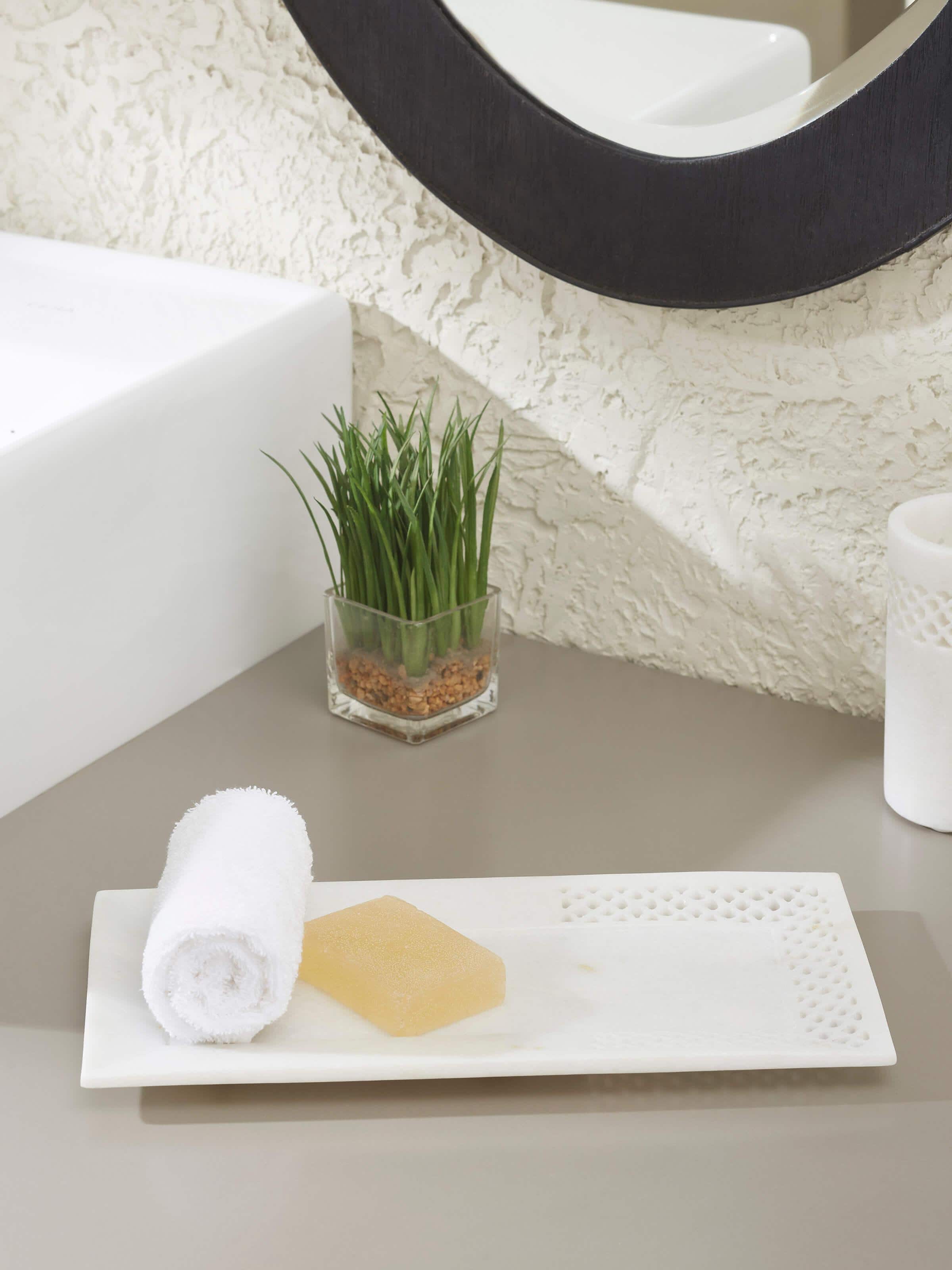 Side view of Carved Ambaji marble bath tray in white, showcasing its detailed carvings and smooth finish.