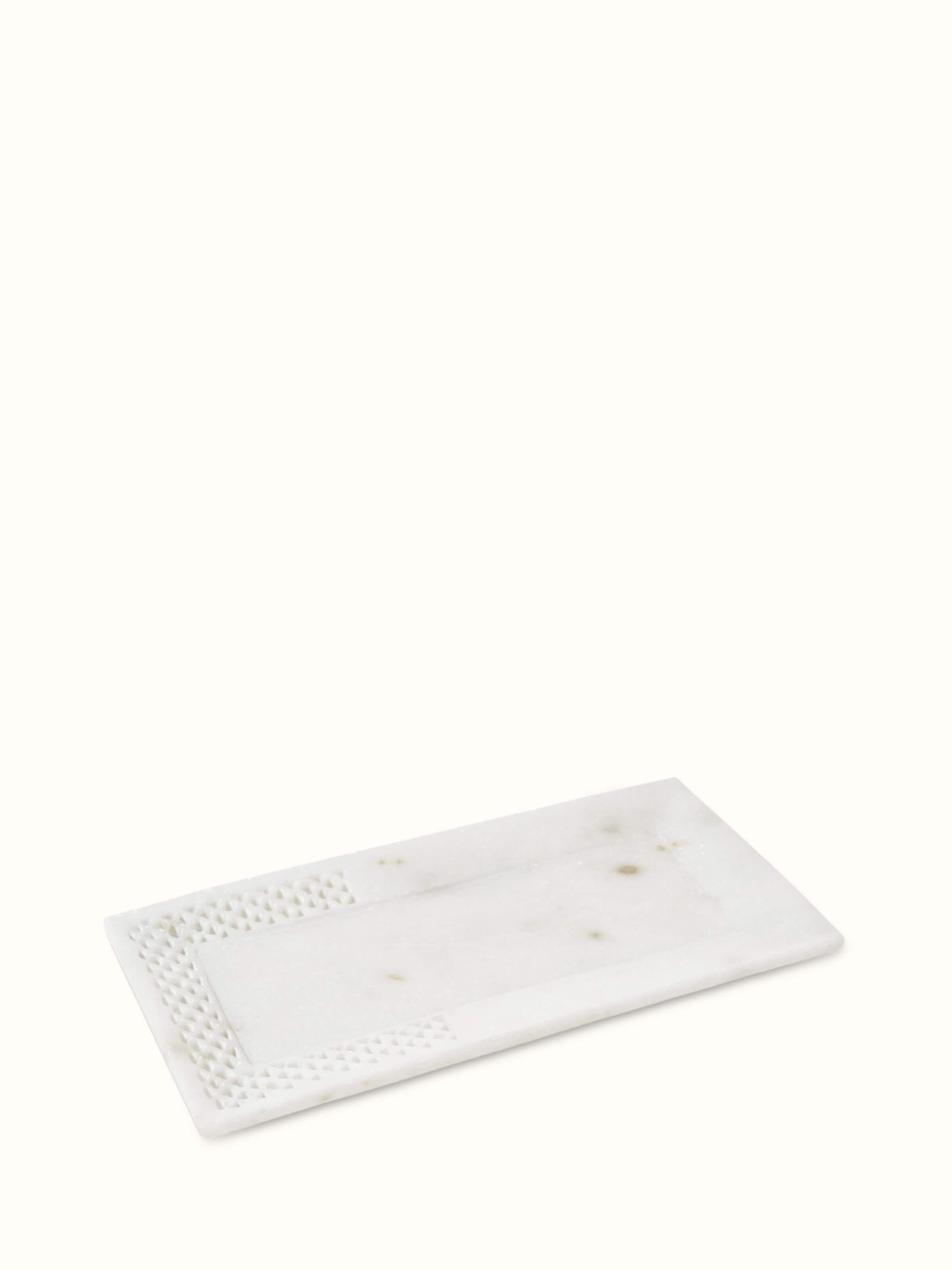 Angled view of Carved Ambaji marble bath tray in white, focusing on the elegant design and fine details.