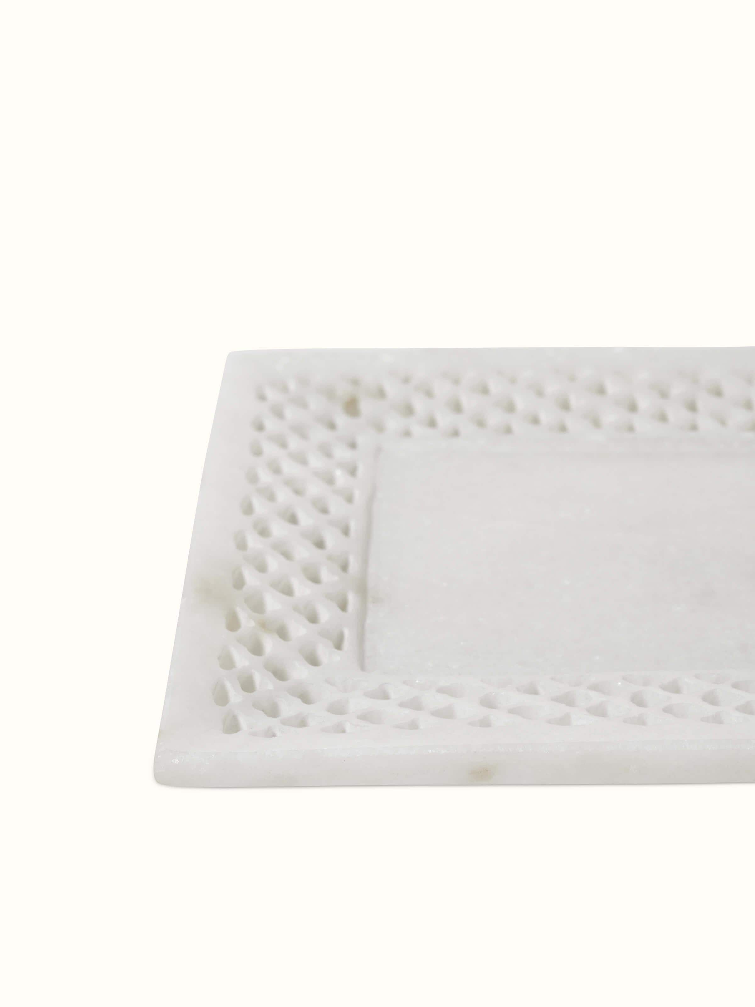 Detailed view of Carved Ambaji marble bath tray in white, emphasizing the craftsmanship and polished surface.