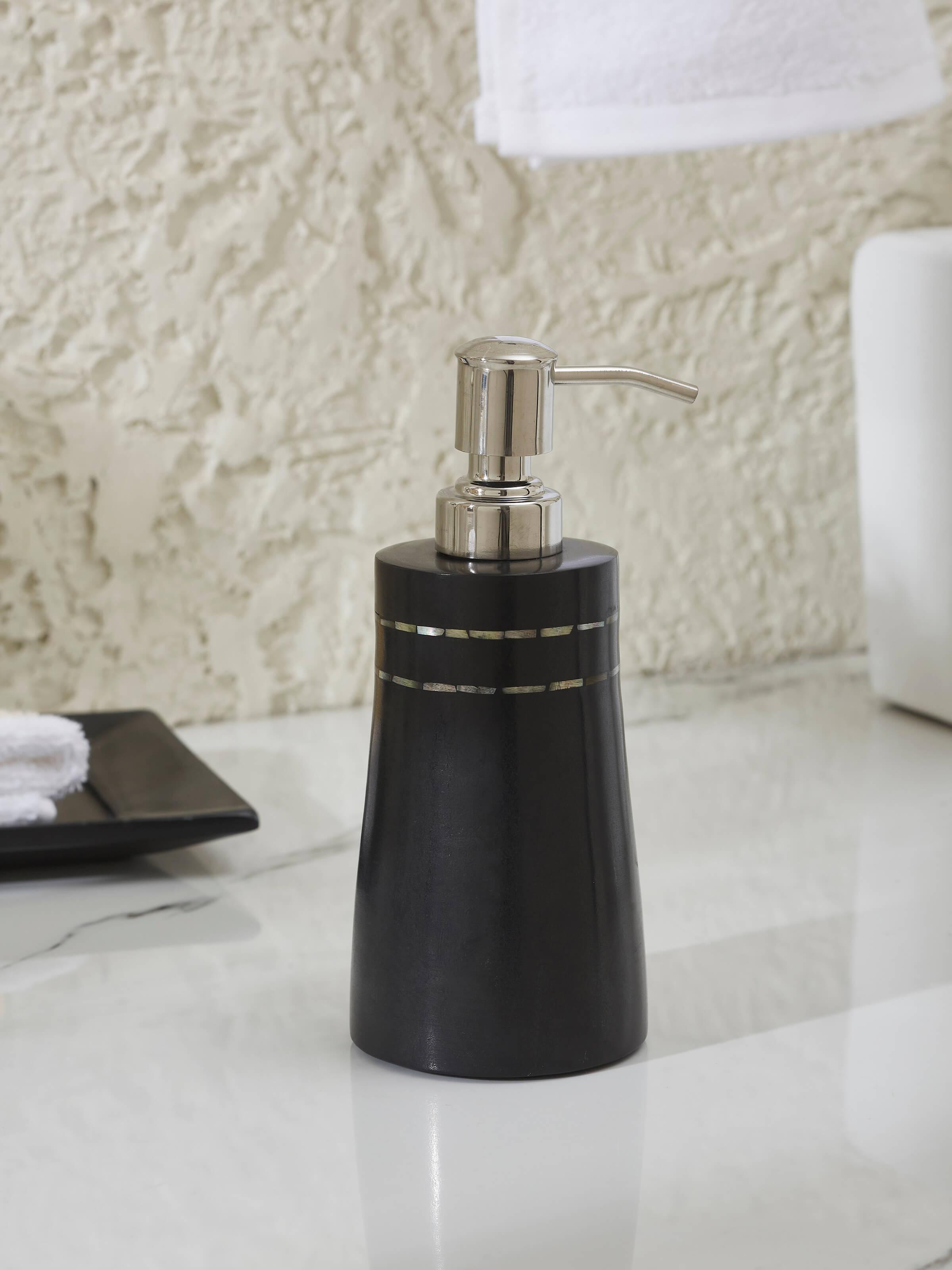 Side view of Carved Ambaji Marble Soap Dispenser in Black highlighting detailed carving.