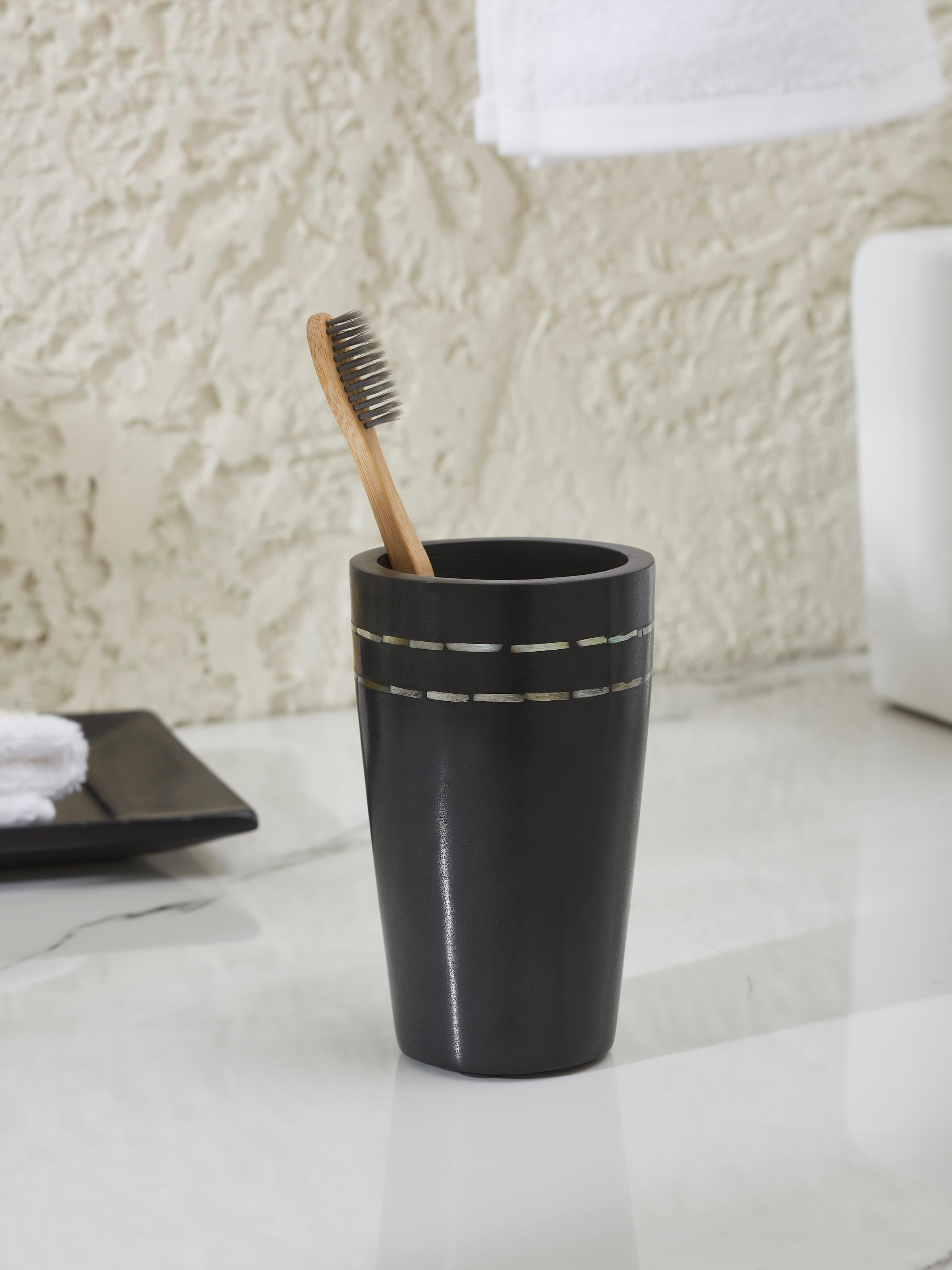 Side view of Carved Marble Stone Toothbrush Holder in Black Color highlighting elegant design