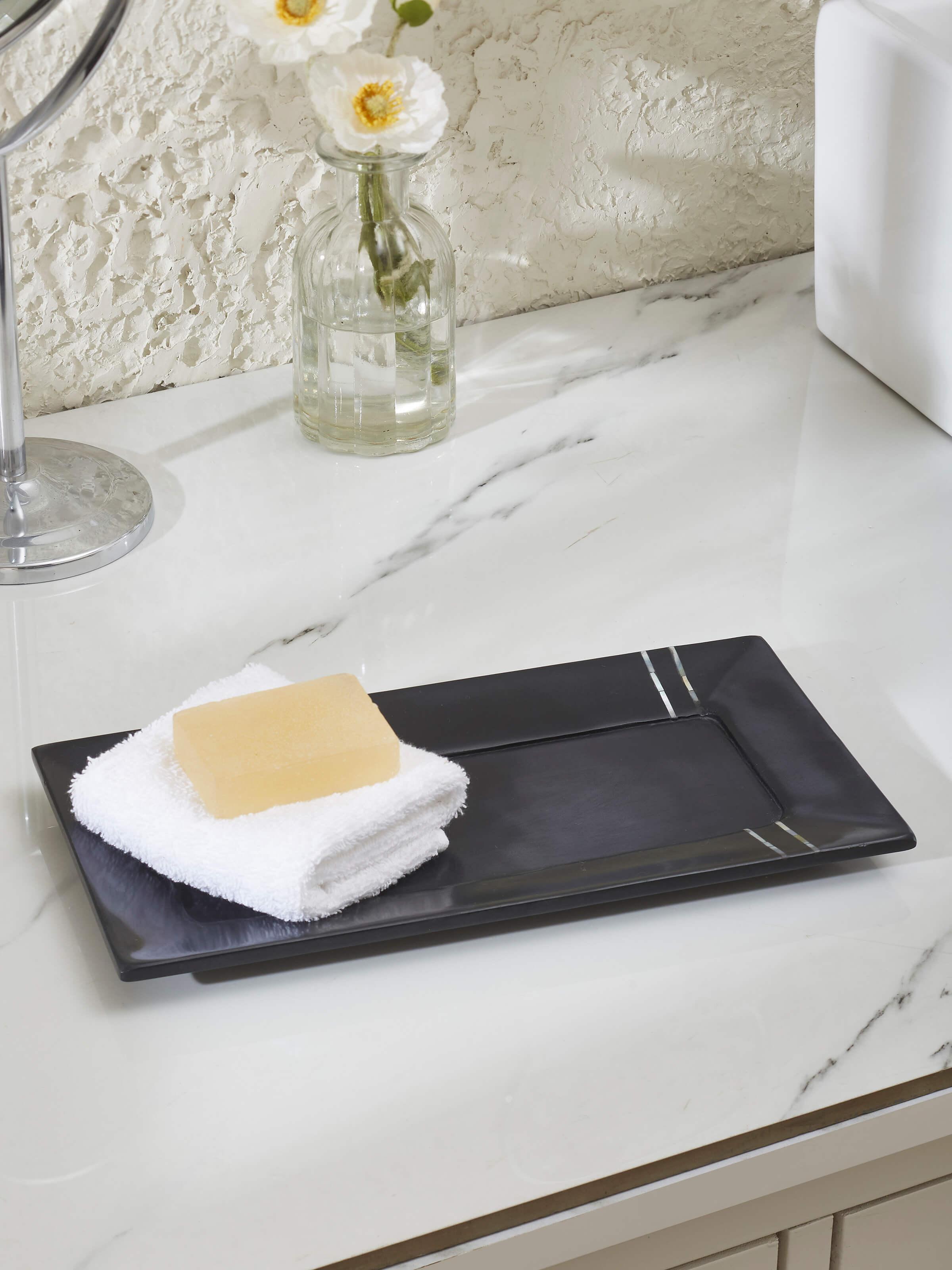 Side view of Carved marble stone bath tray in black color showing the smooth marble texture