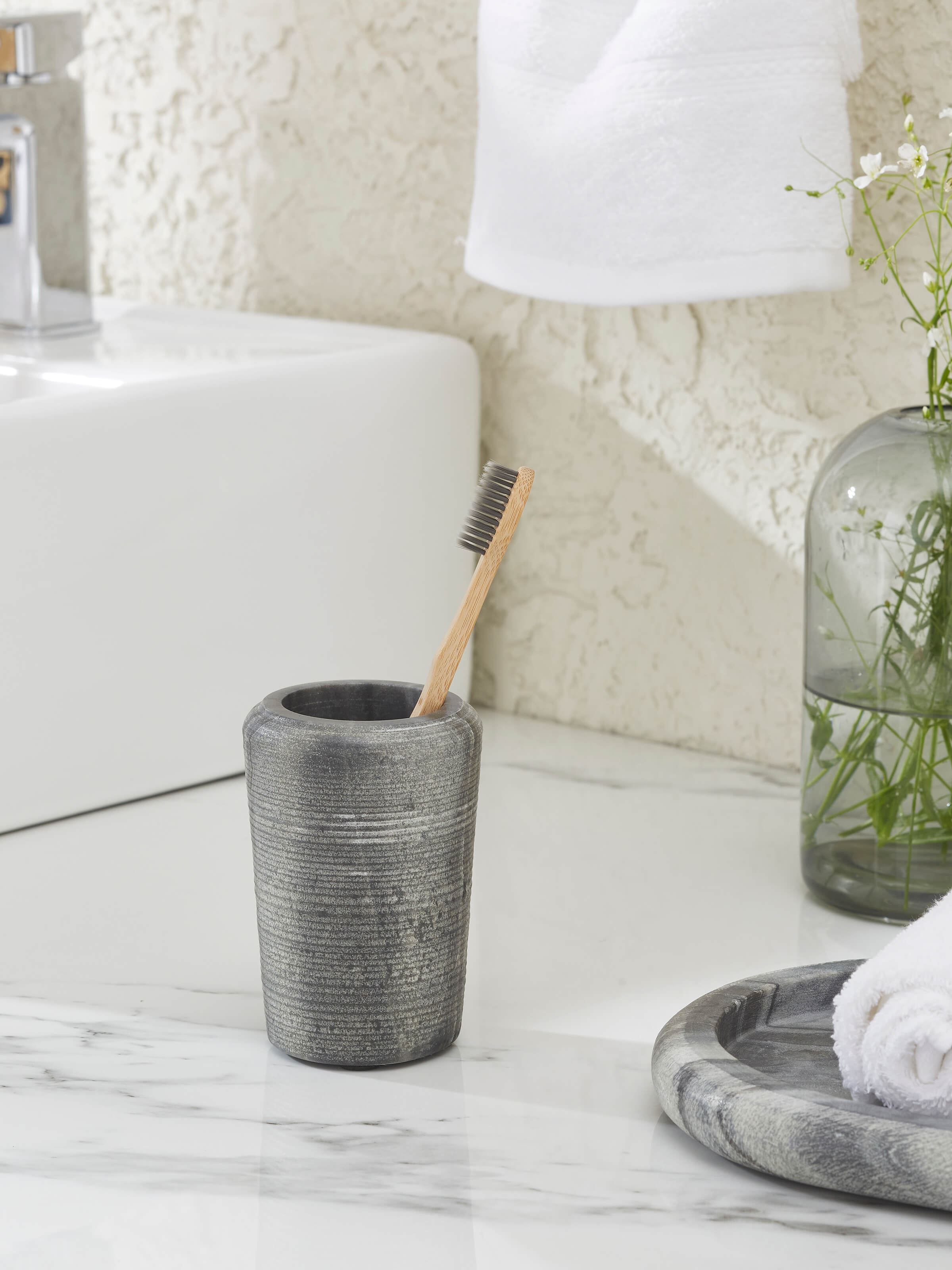 Side view of Carved Marble Toothbrush Holder in Grey color showing its carved details