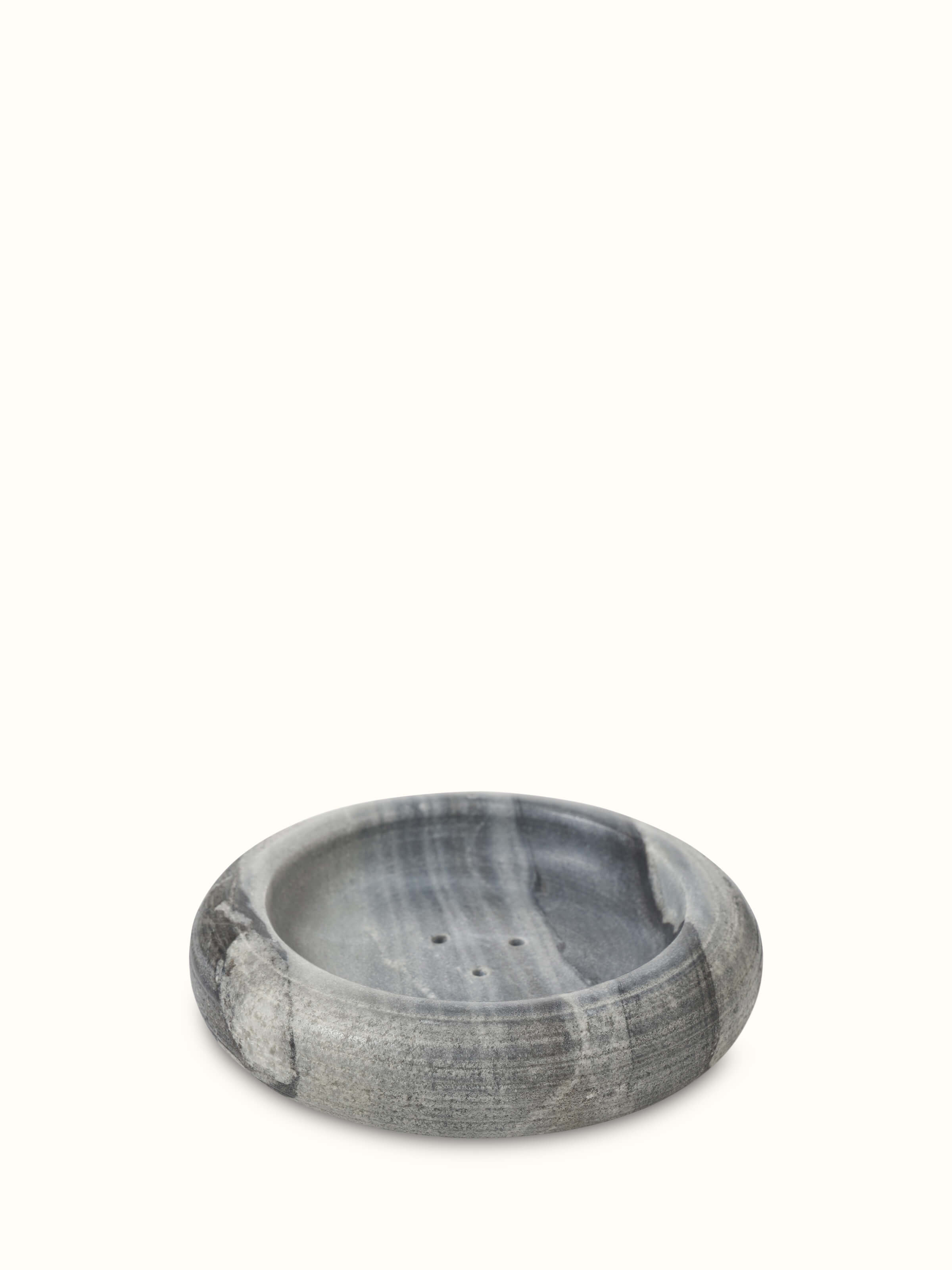 Top view of grey carved marble soap dish emphasizing fine detailing