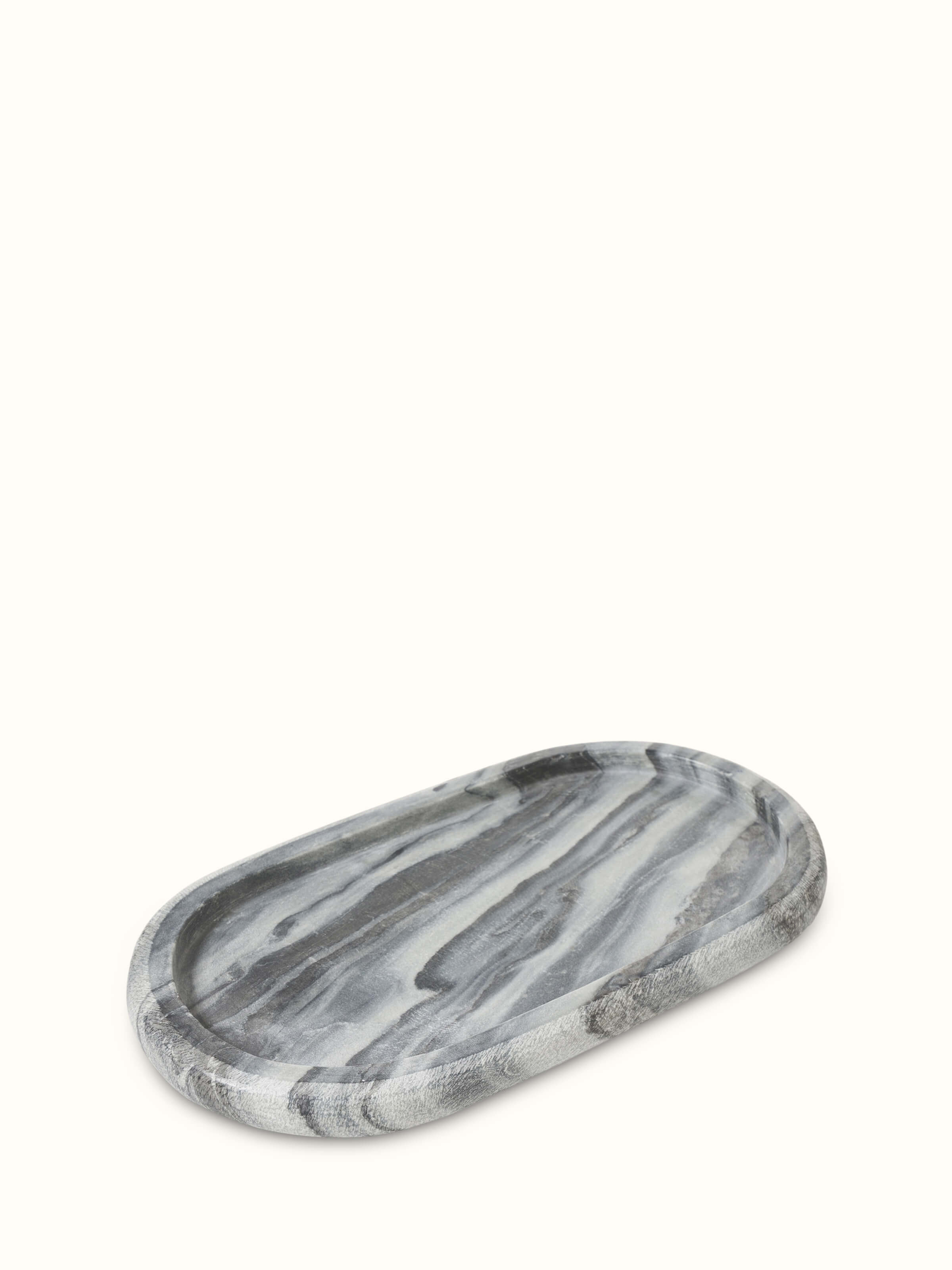 Close-up of carved marble bath tray in grey color showing its refined texture