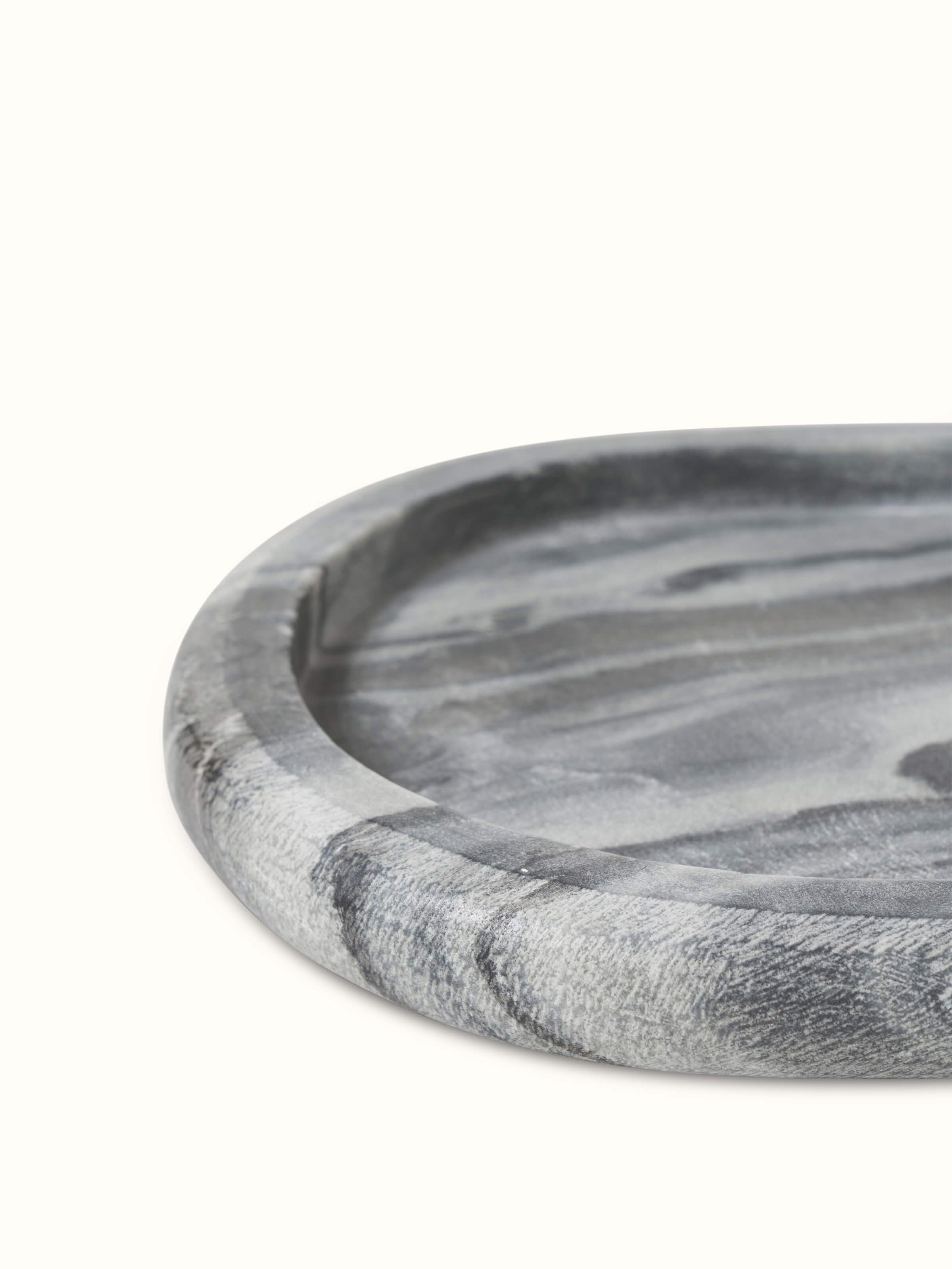 Detailed view of carved marble bath tray in grey color emphasizing its design