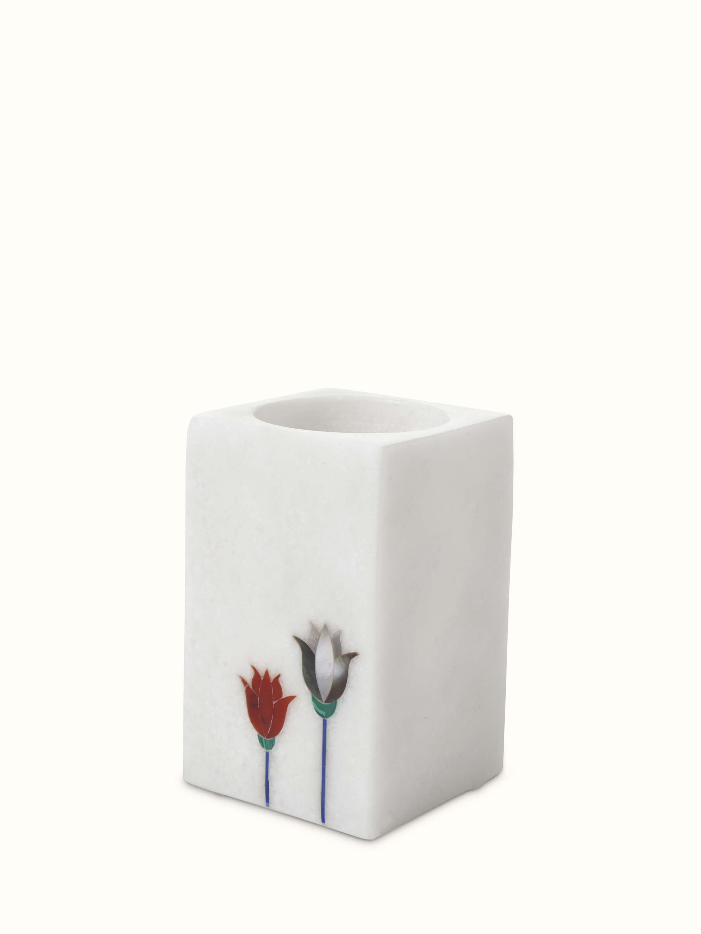 Close-up of Carved Ambaji white marble floral toothbrush holder showcasing elegant floral design.