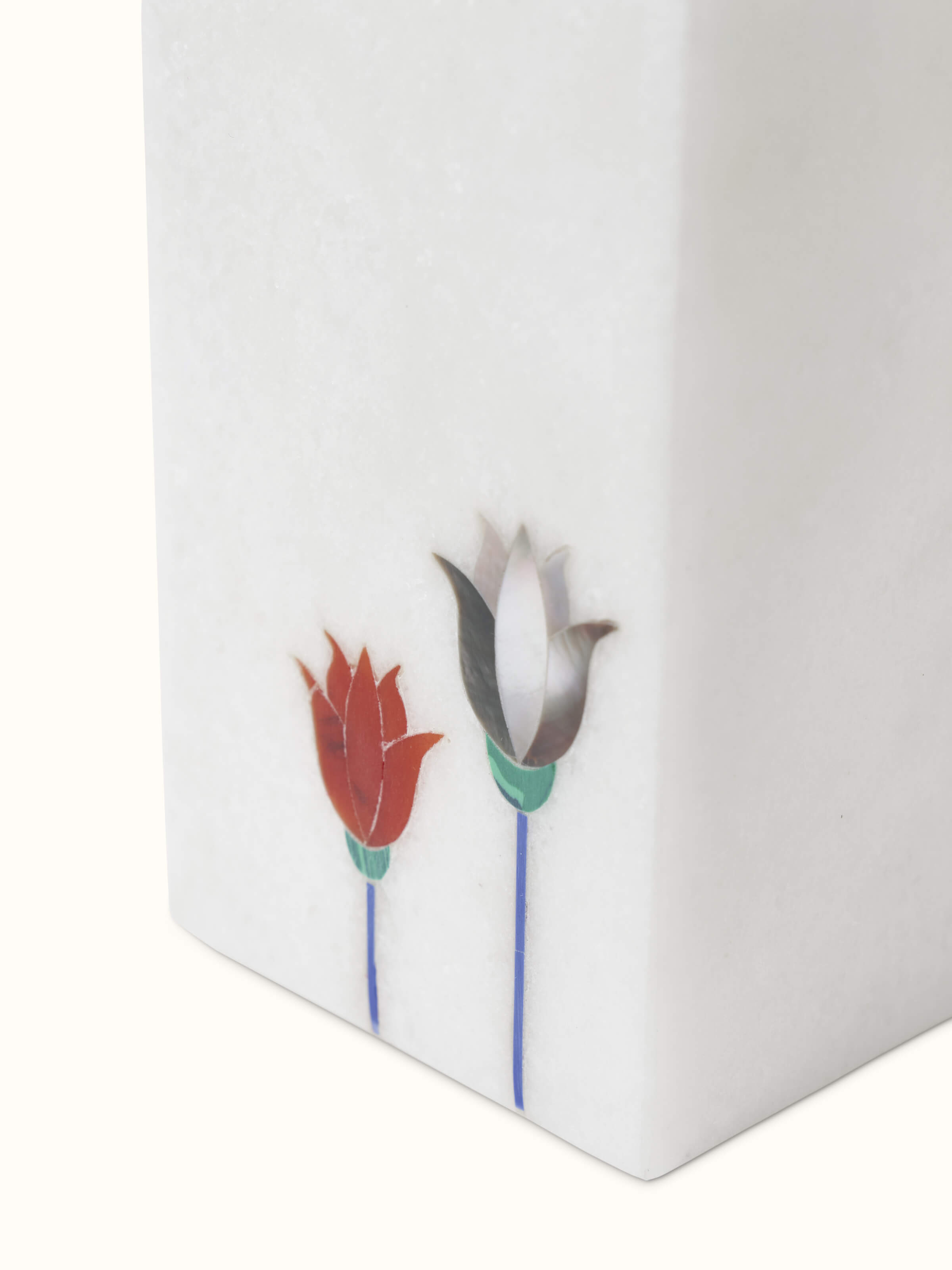 Detailed close-up of Carved Ambaji white marble floral toothbrush holder highlighting the fine marble work.