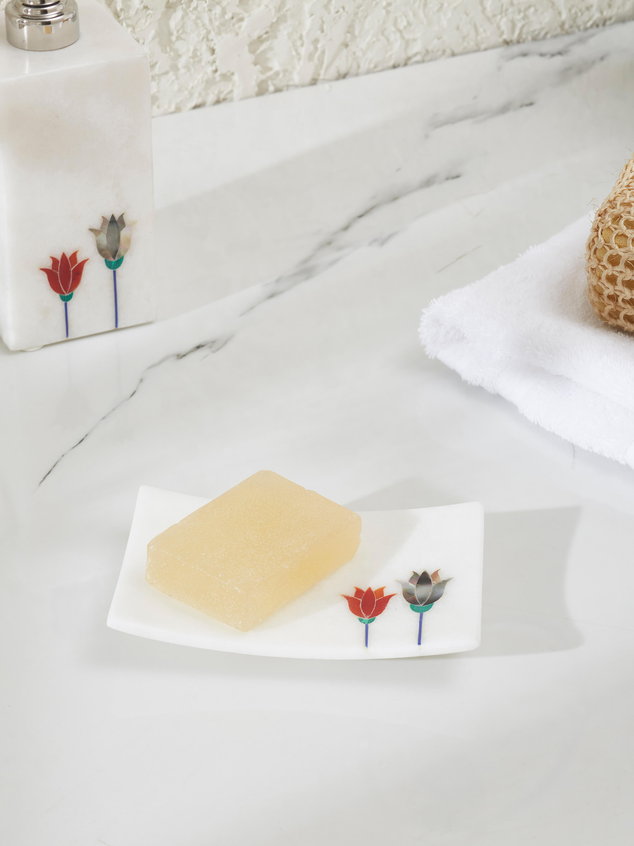 Close-up of carved Ambaji white marble lotus soap dish highlighting its fine craftsmanship and design.