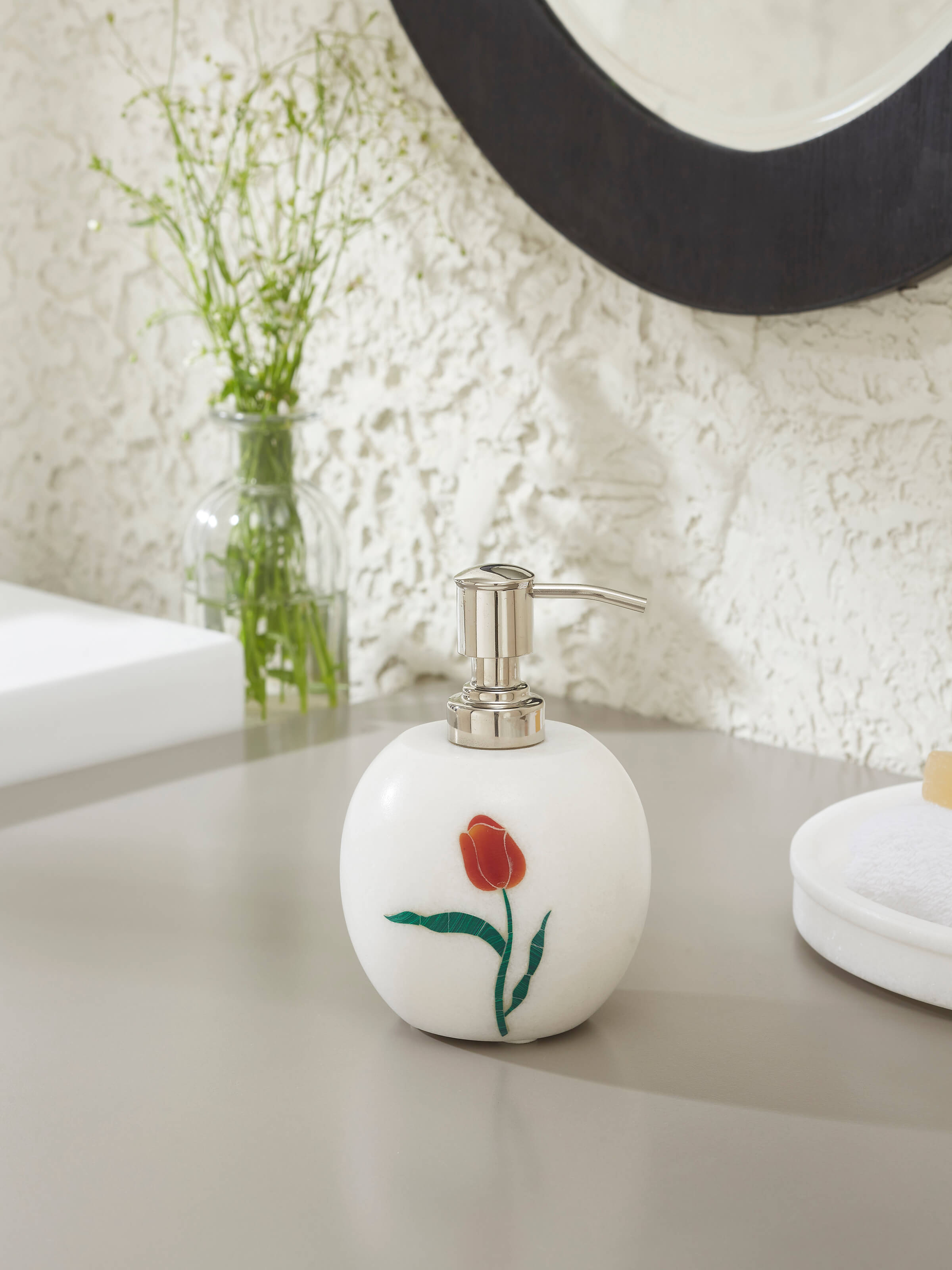 Side view of carved Ambaji white marble rose soap dispenser showcasing its elegant design