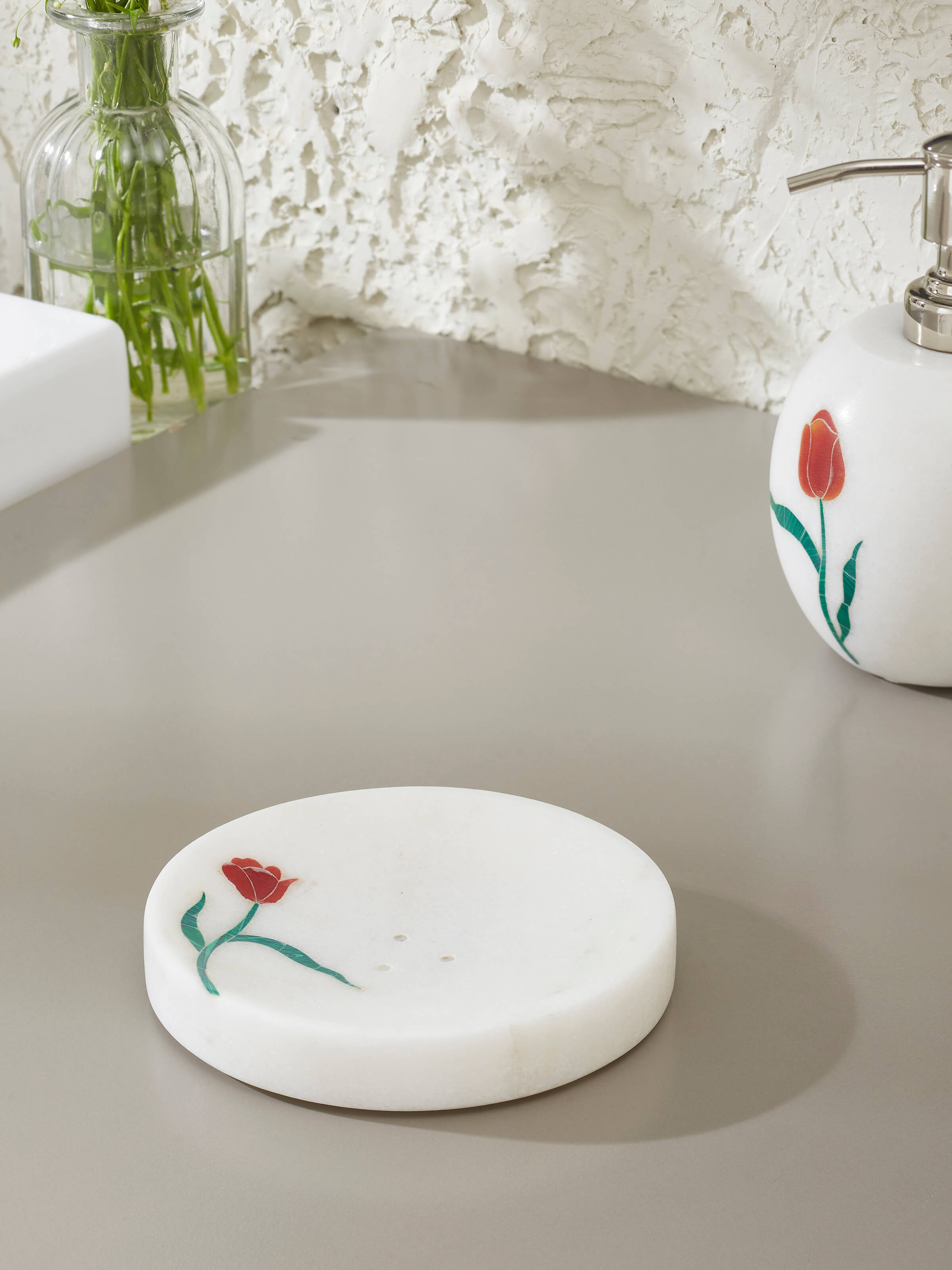 Side view of Carved Ambaji white marble rose soap dish highlighting intricate marble work.