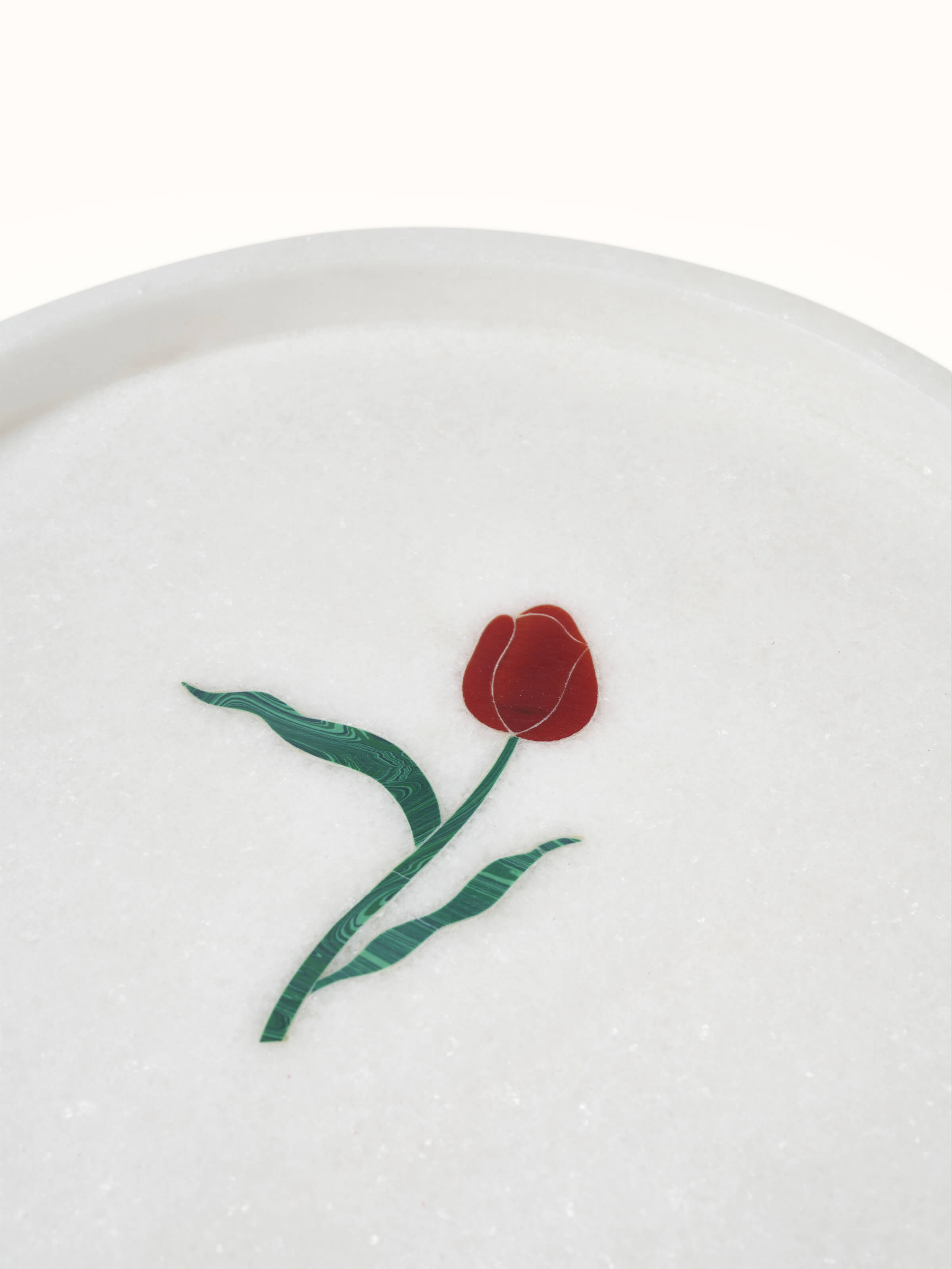 Detailed view of white carved Ambaji marble bath tray displaying sophisticated design