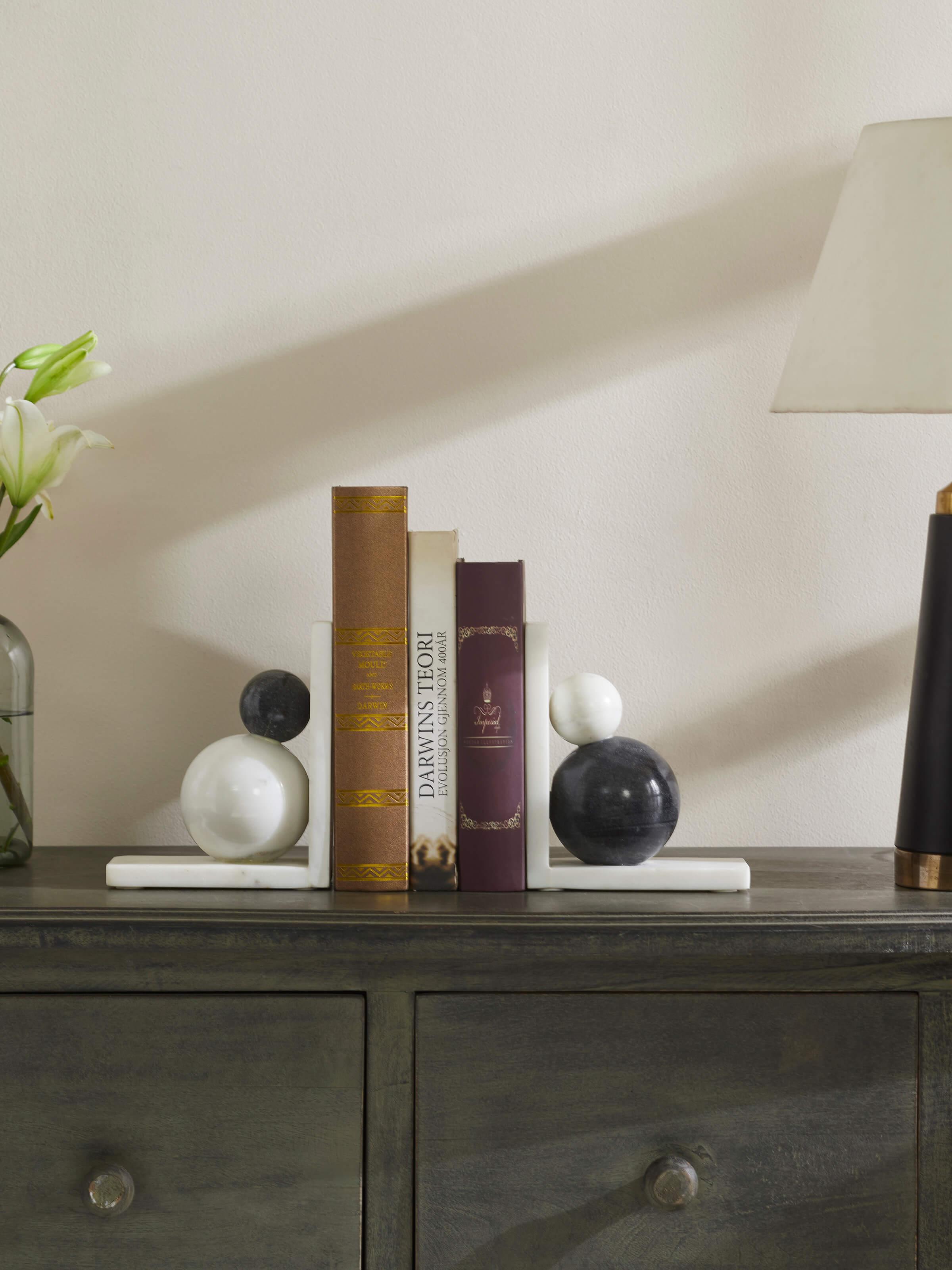 Side view of carved marble bookend in white color showing its smooth and refined design
