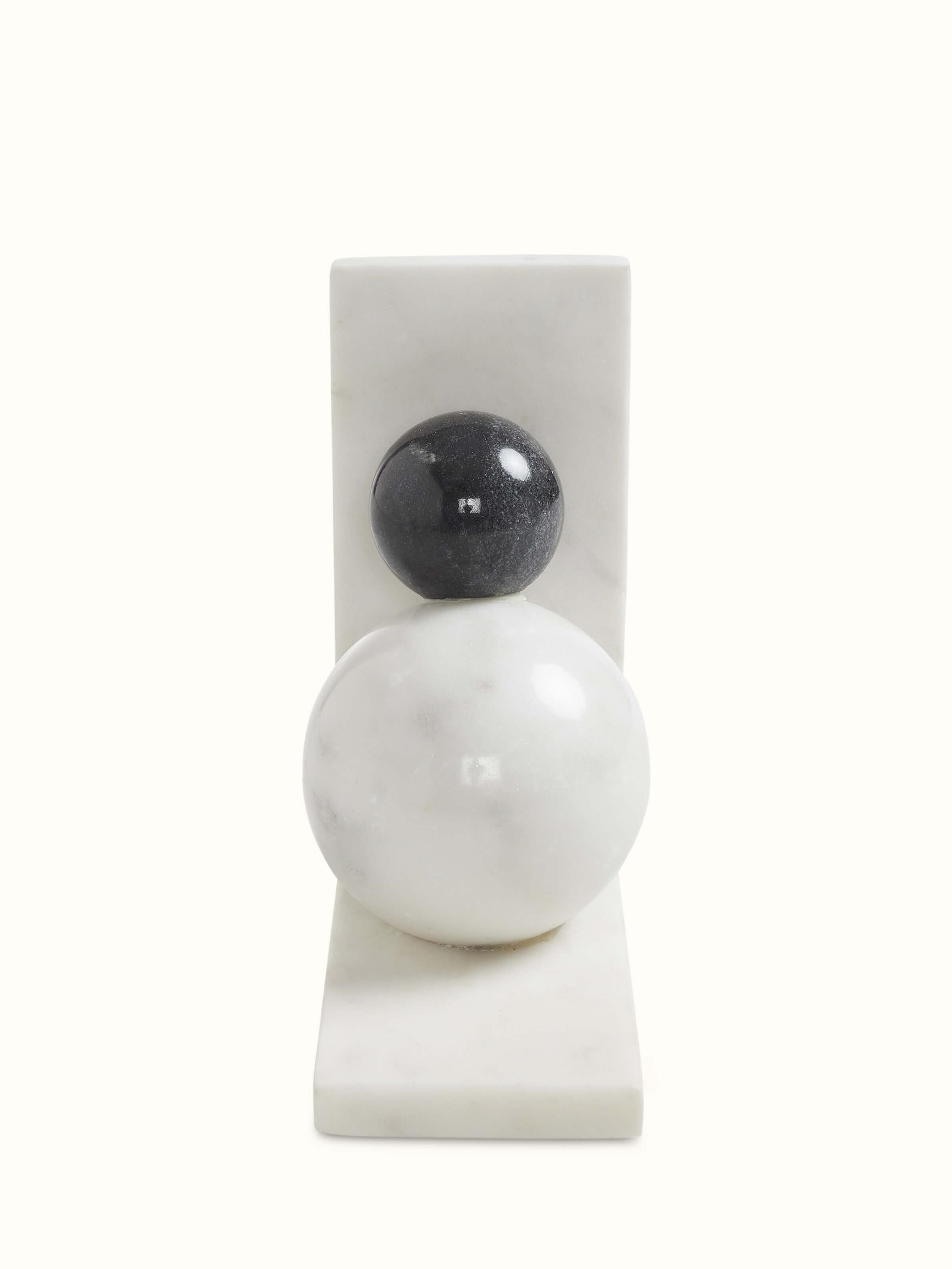 Top view of carved marble bookend in white color revealing its sleek, geometric design