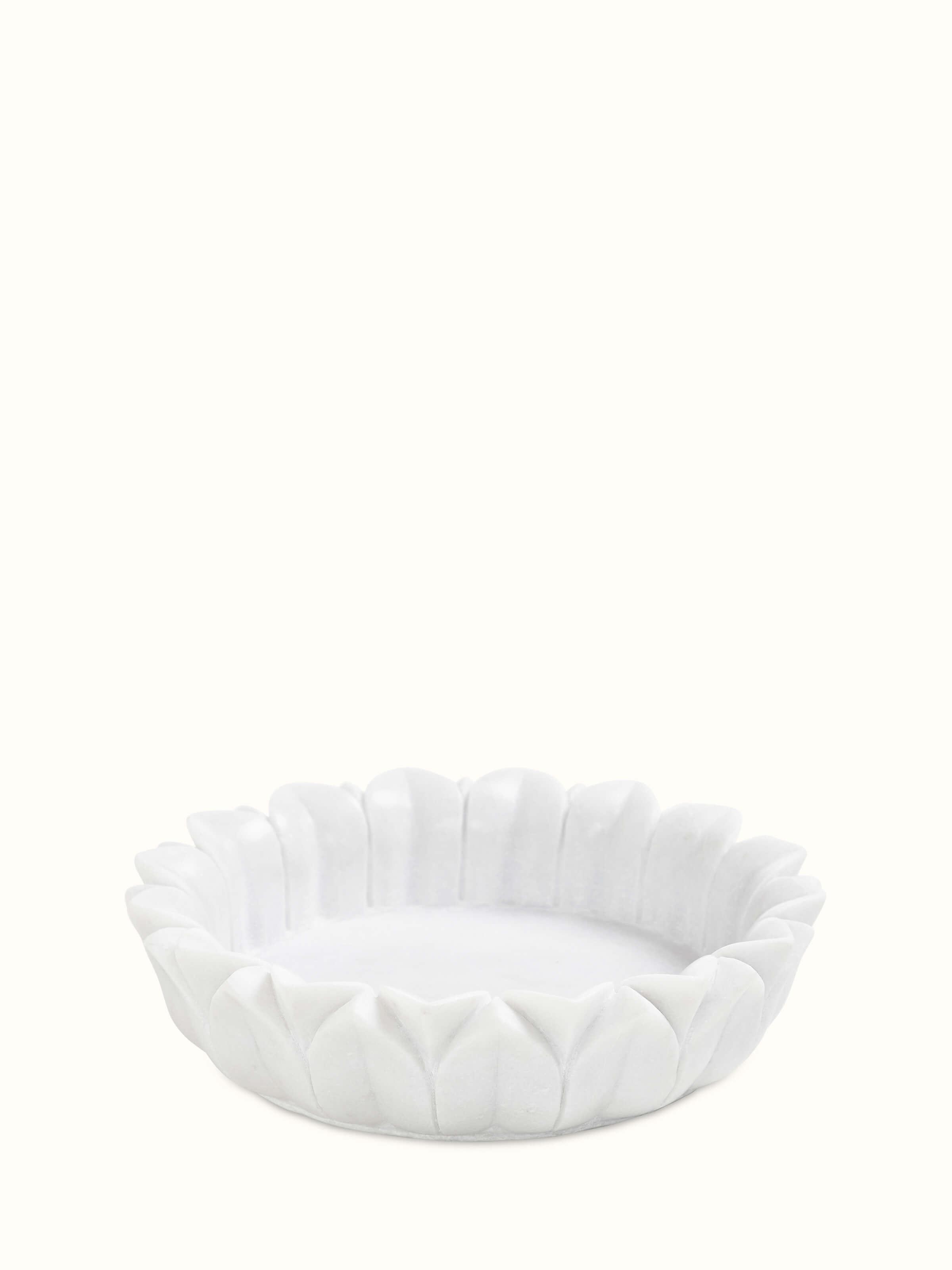Front view of Glossy Carved Marble Urli showcasing intricate carvings.