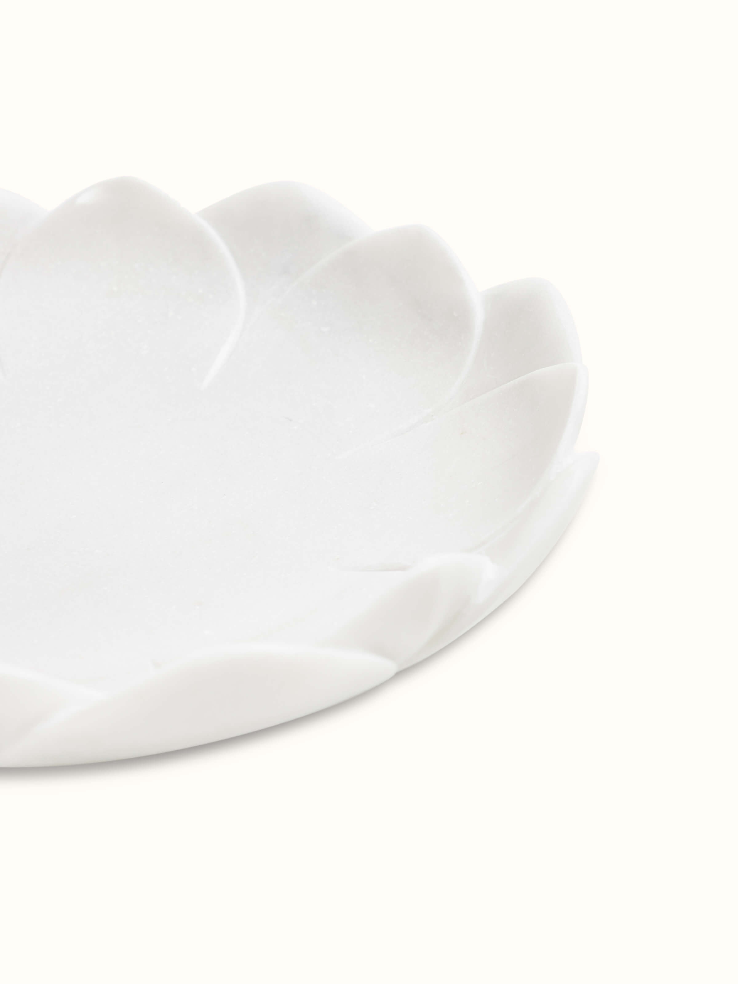 Detail view of Flat Carved Marble Urli focusing on the intricate marble carving and texture.