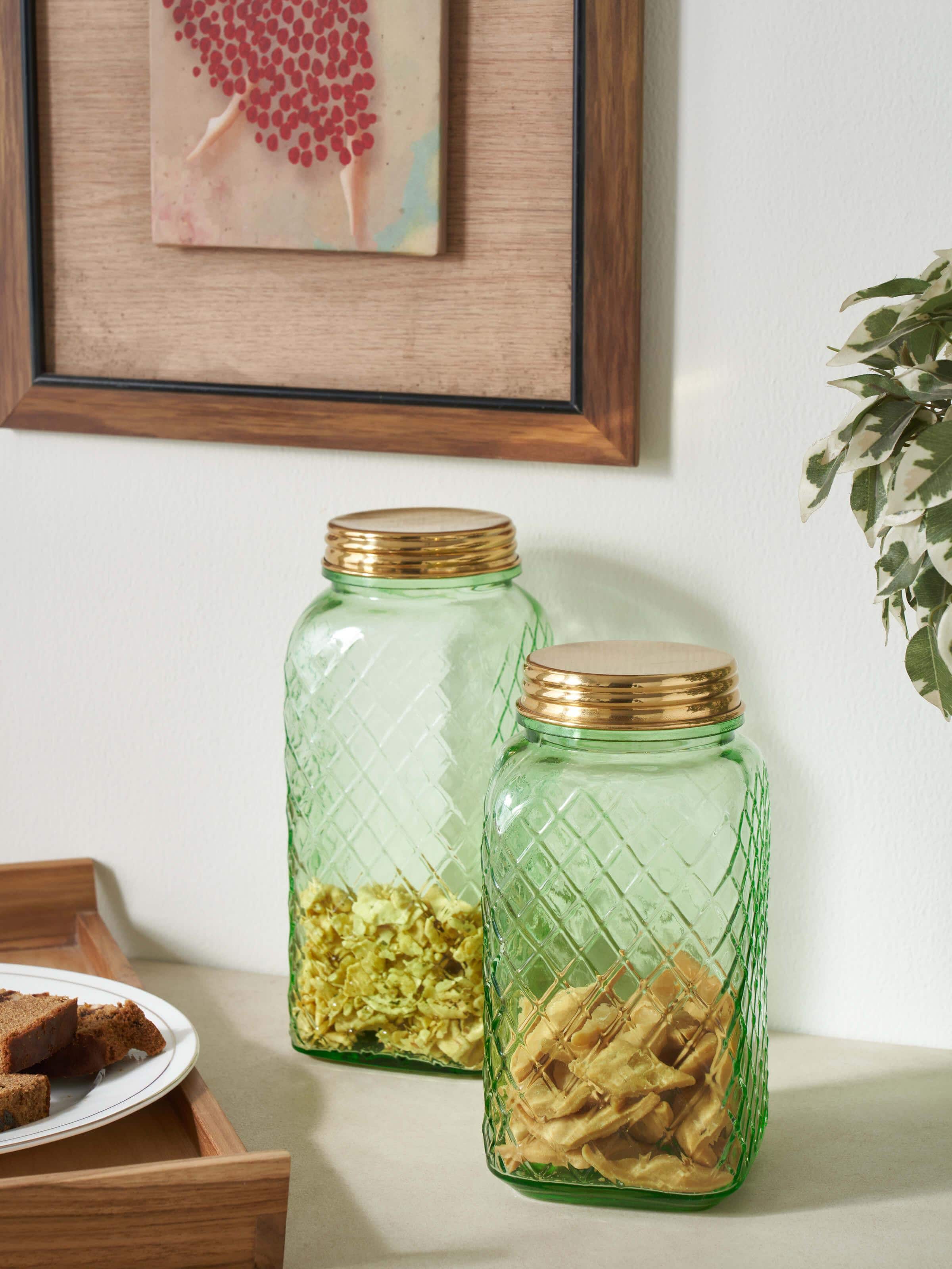 Side view of green glass-worked storage containers, set of 2, highlighting the glass texture and color.